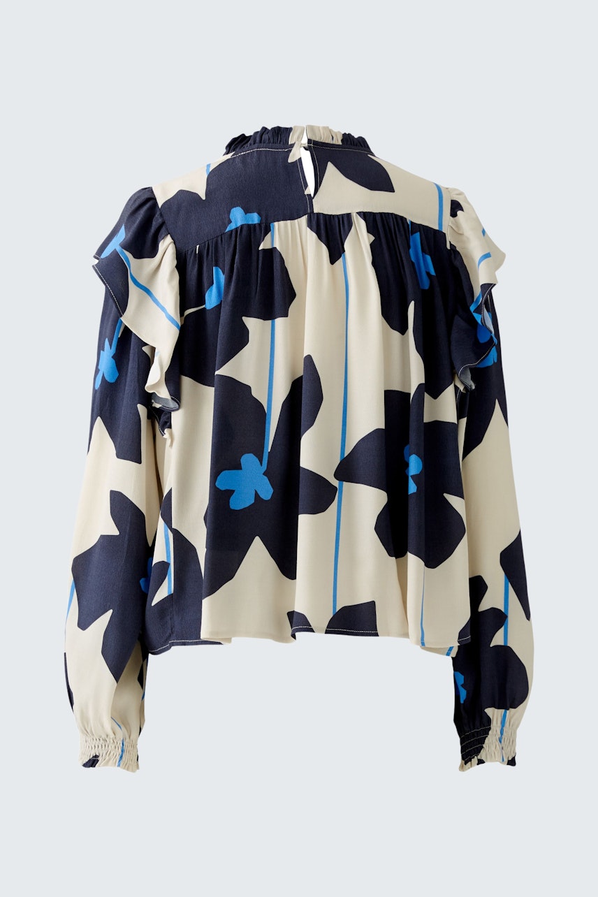 Stylish women's blouse with a floral pattern, featuring ruffled details and a relaxed fit.