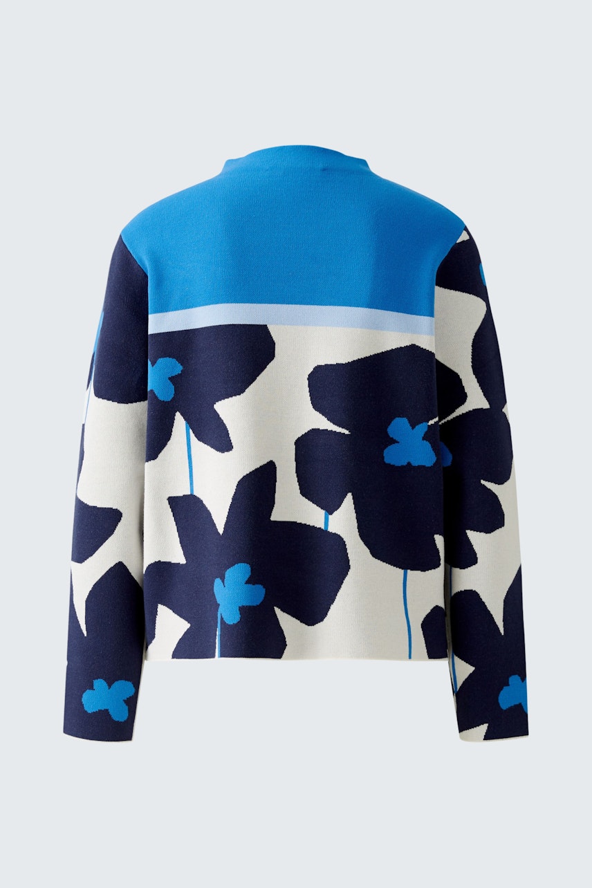 Damen-Pullover: Rückansicht eines farbenfrohen Pullovers mit großen blauen Blumen auf weißem Grund.