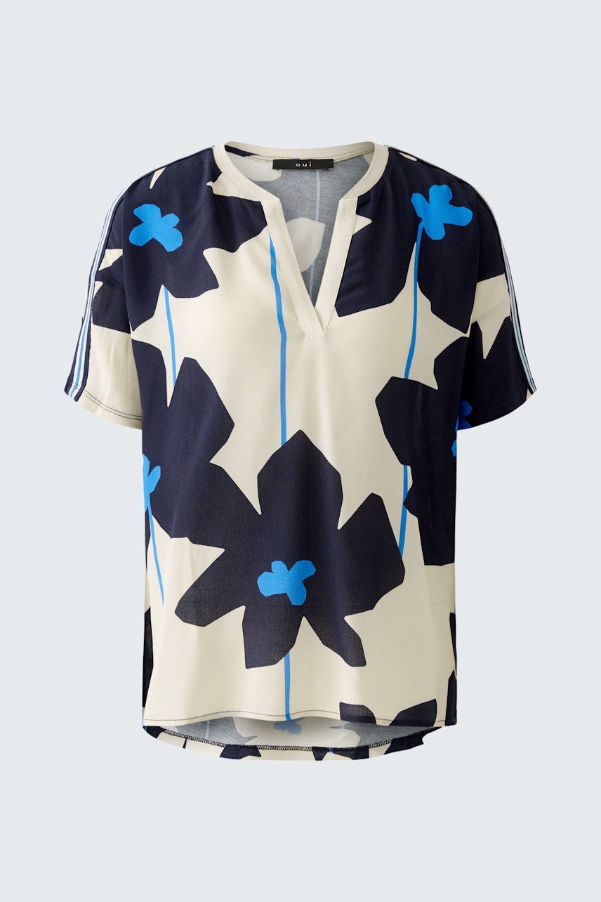 Stylish women's blouse shirt with a floral pattern in navy and blue tones.