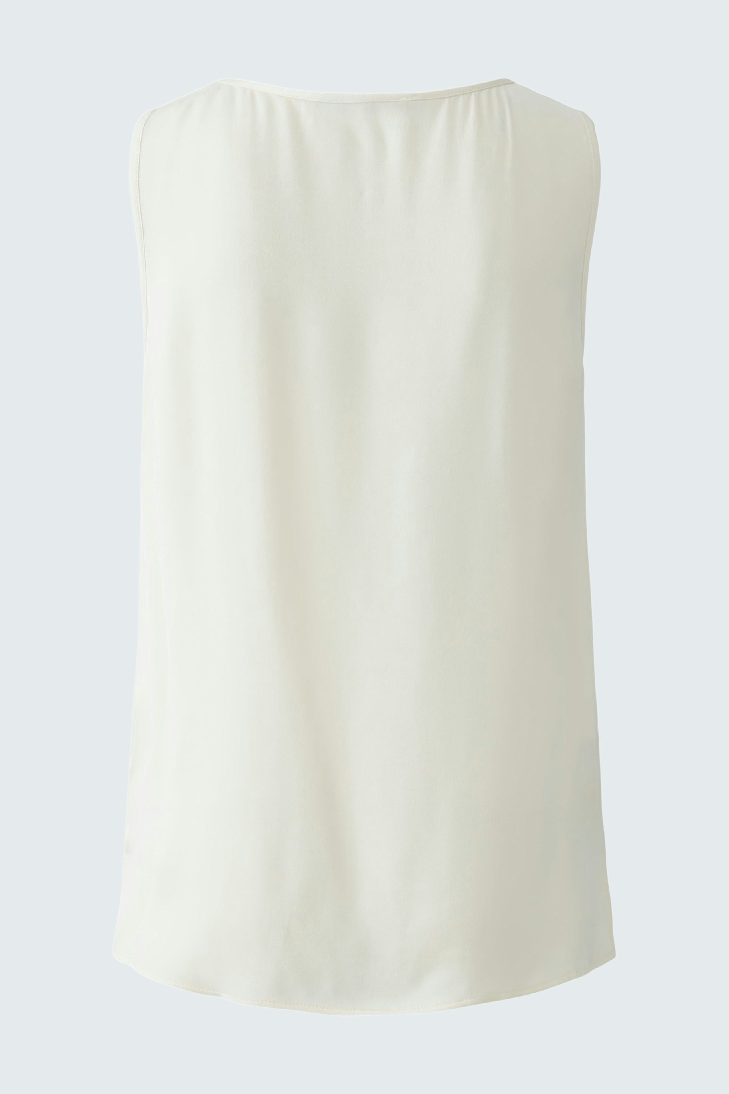 Elegant women's top: A simple, sleeveless design in soft white, perfect for layering or warm weather.