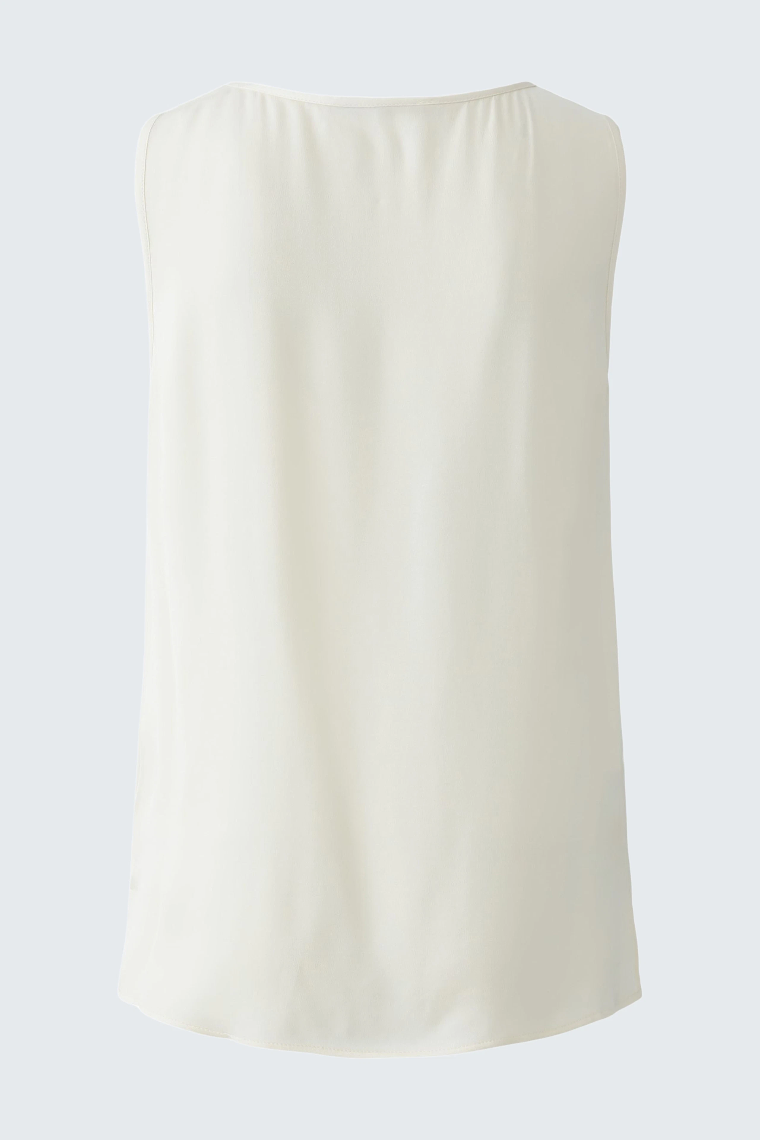 Elegantes Damen-Top in sanftem Weiß, ideal für lässige und schicke Anlässe.