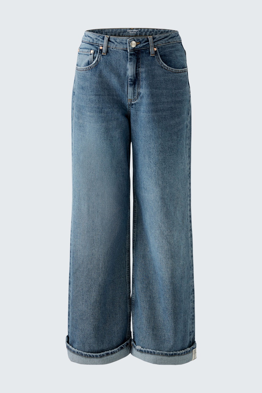 Stylish women's straight jeans in a classic blue wash, featuring a relaxed fit and rolled cuffs.