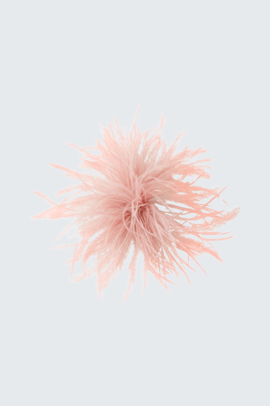 Elegant brooch: A delicate pink accessory with intricate details, perfect for enhancing any outfit.