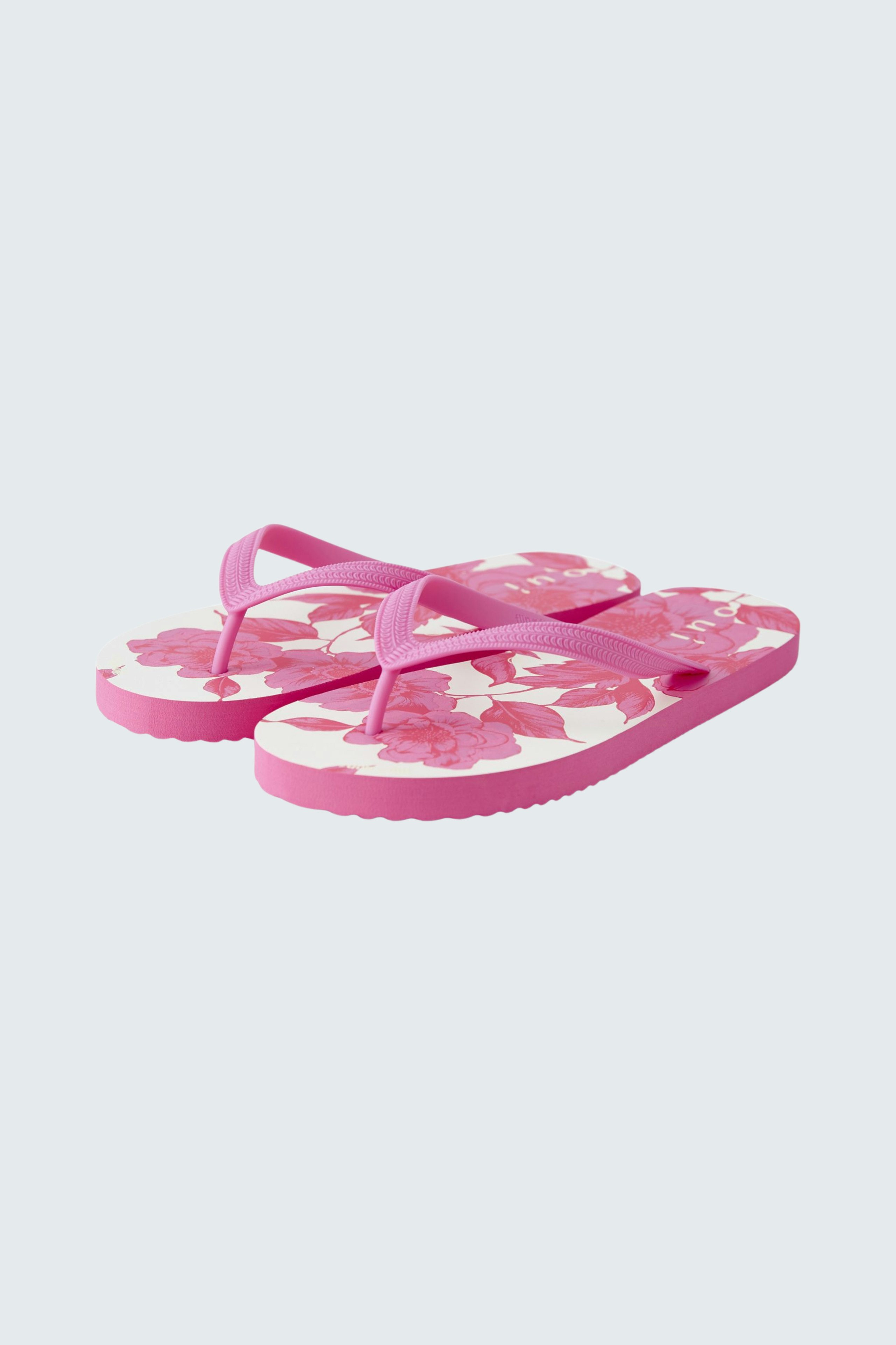 Bunte Damen-Flip-Flops in Pink mit floralem Muster, ideal für den Sommer.