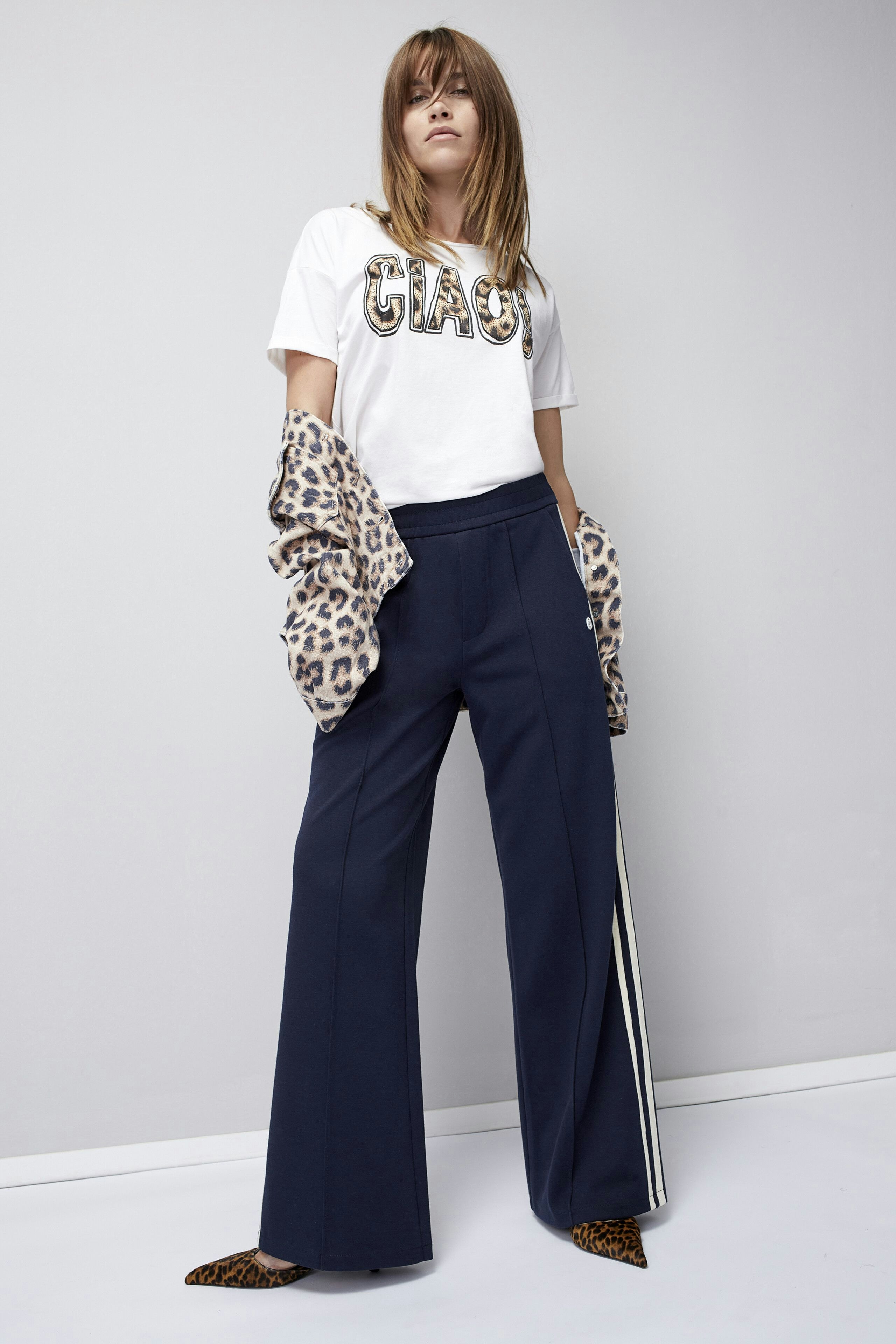 Stylish women's jeans jacket: A confident woman in a chic denim jacket, perfect for casual outfits.