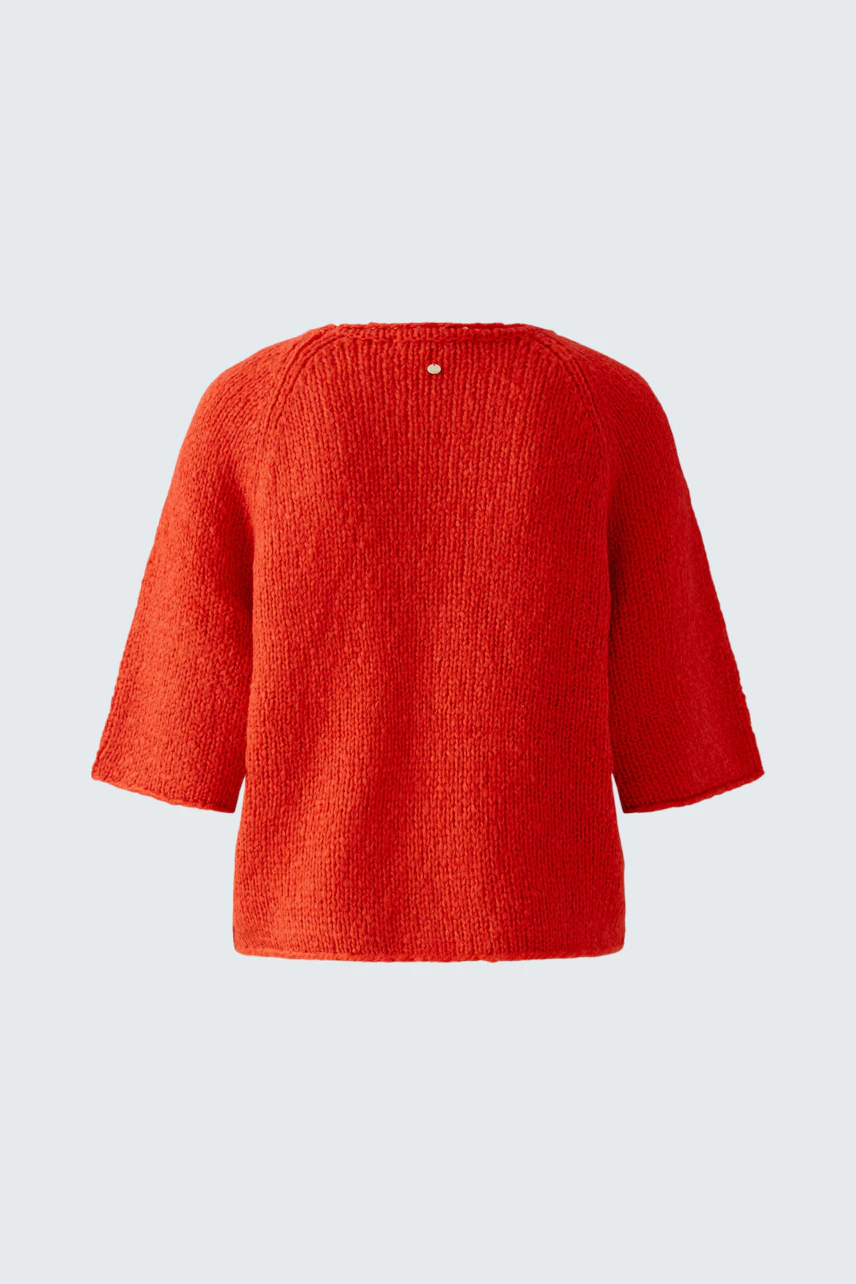 Stylish women's pullover in vibrant red with a relaxed fit and three-quarter sleeves.