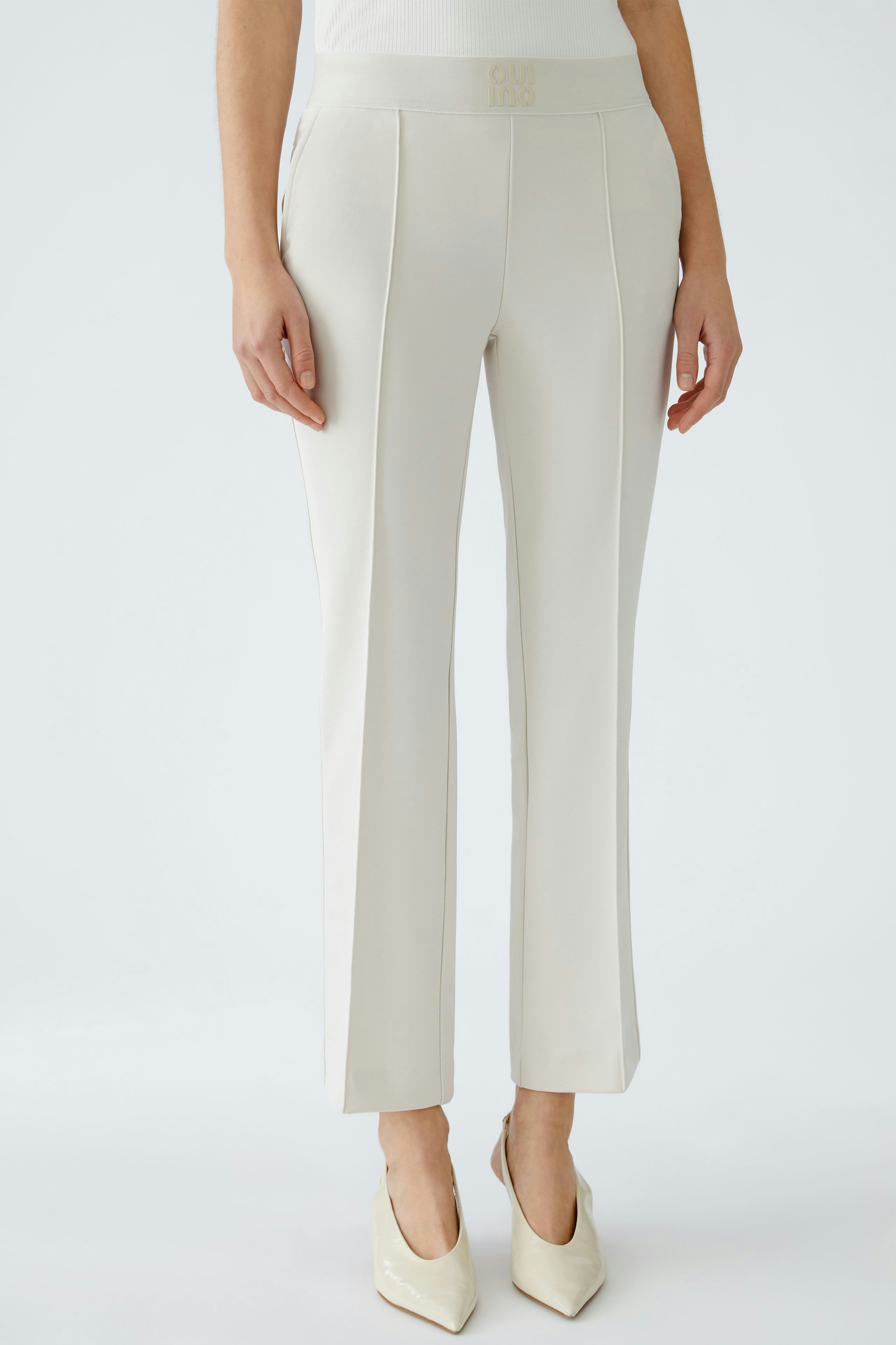 Elegant women's trousers in light beige, tailored fit with a modern design.