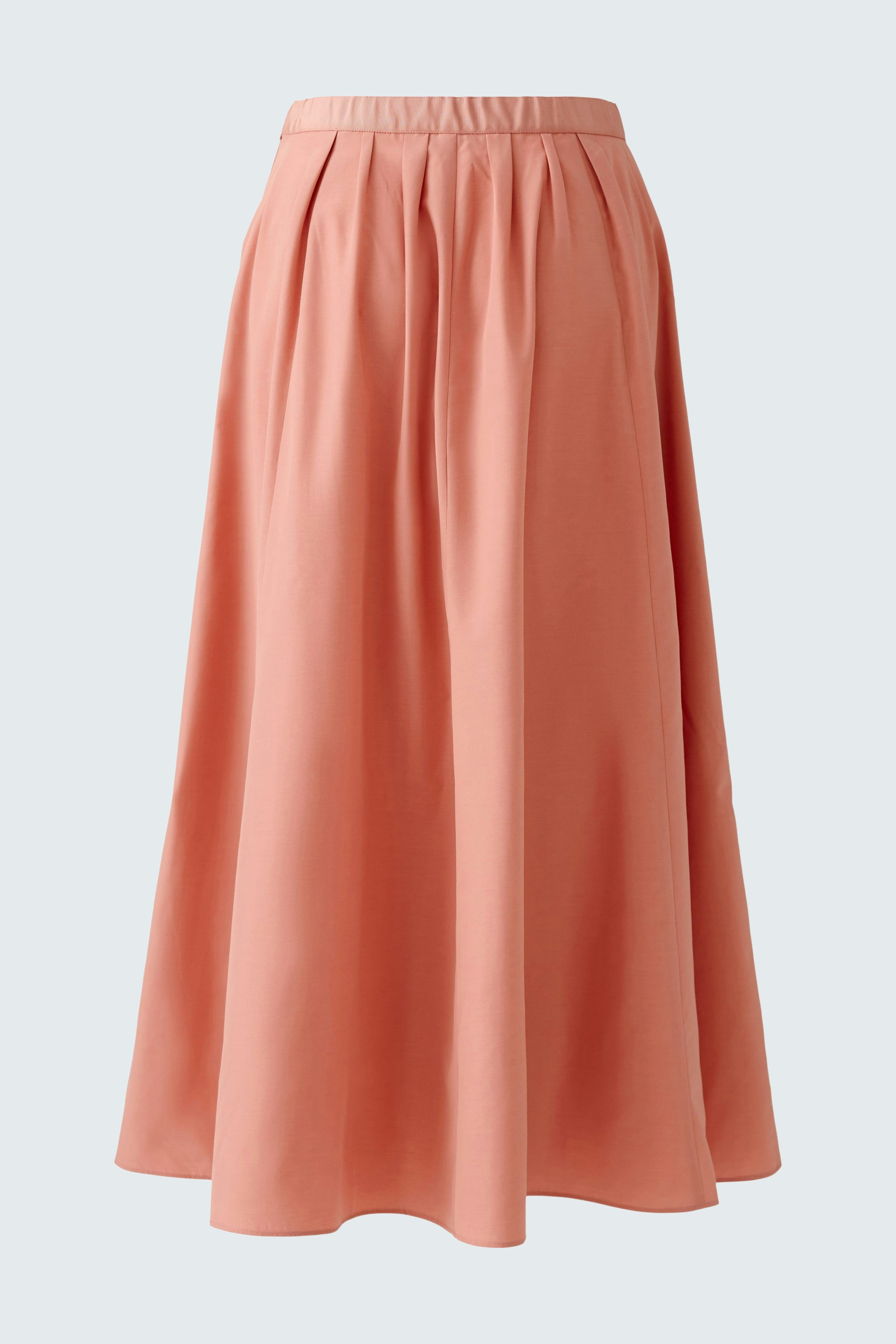 Elegant maxi skirt in soft coral color, featuring a flowy design and comfortable waistband.