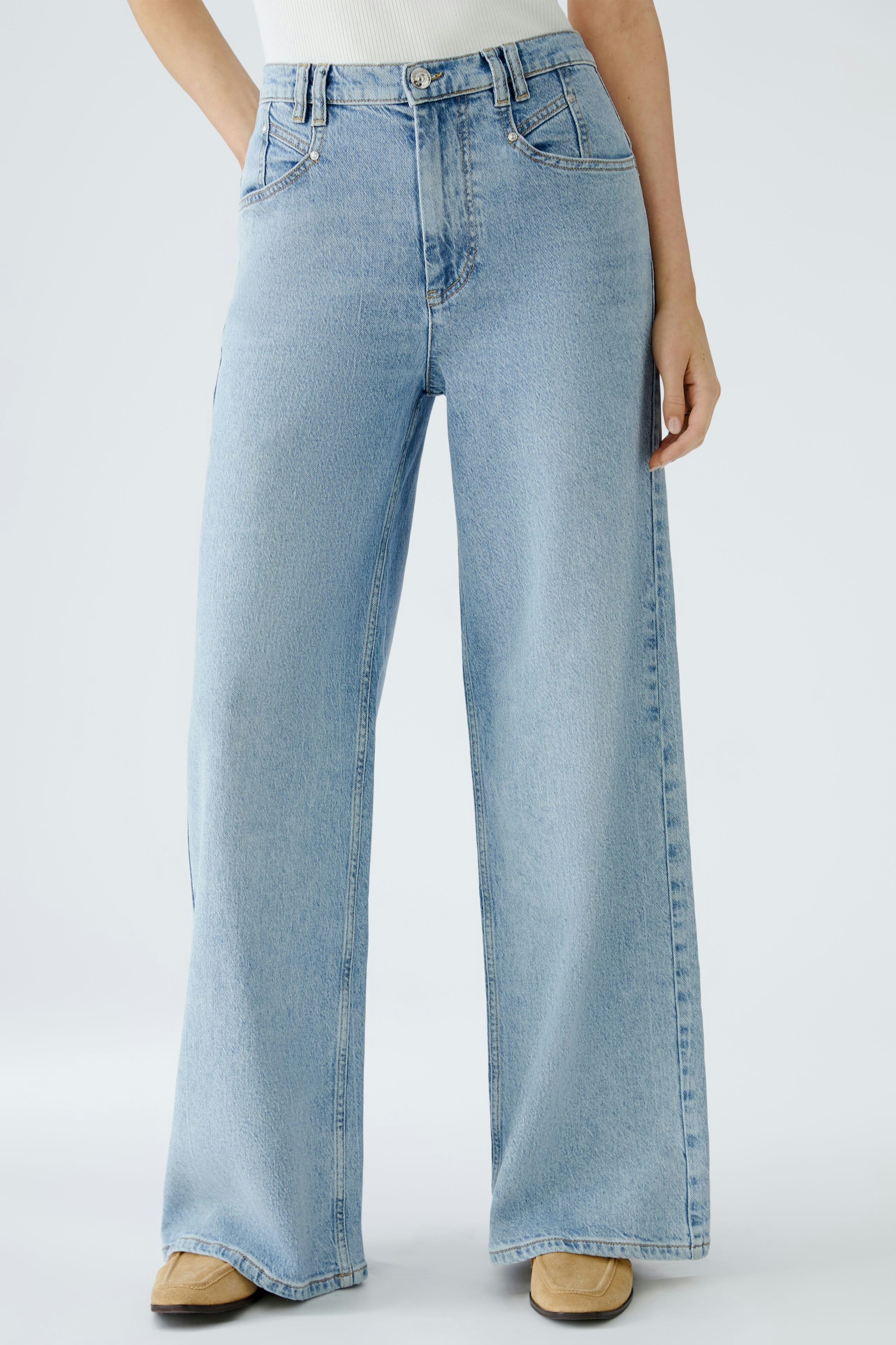 Stylish wide leg jeans for women, featuring a relaxed fit and classic light blue denim.