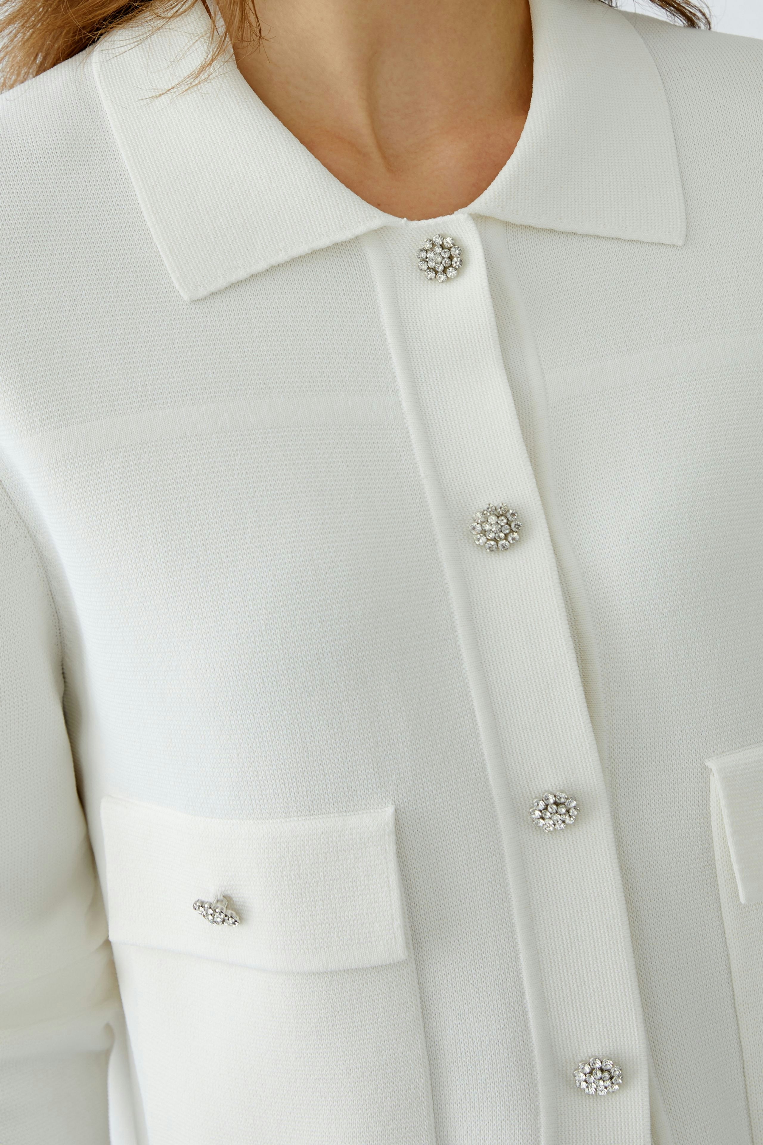 Elegant women's cardigan with decorative buttons, perfect for layering and stylish outfits.