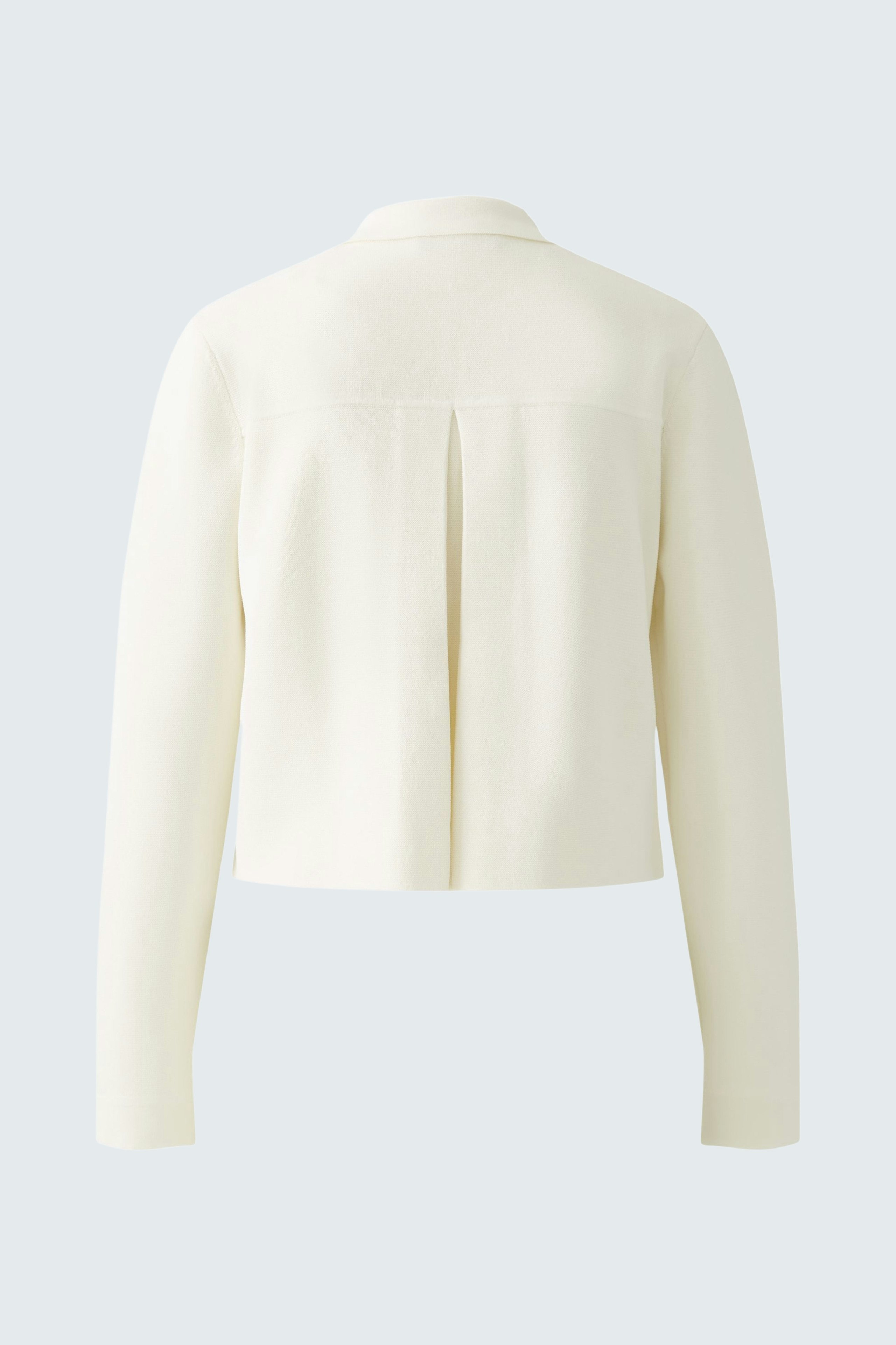 Stylish women's cardigan: A white knitted cardigan with a modern cut, perfect for layering.