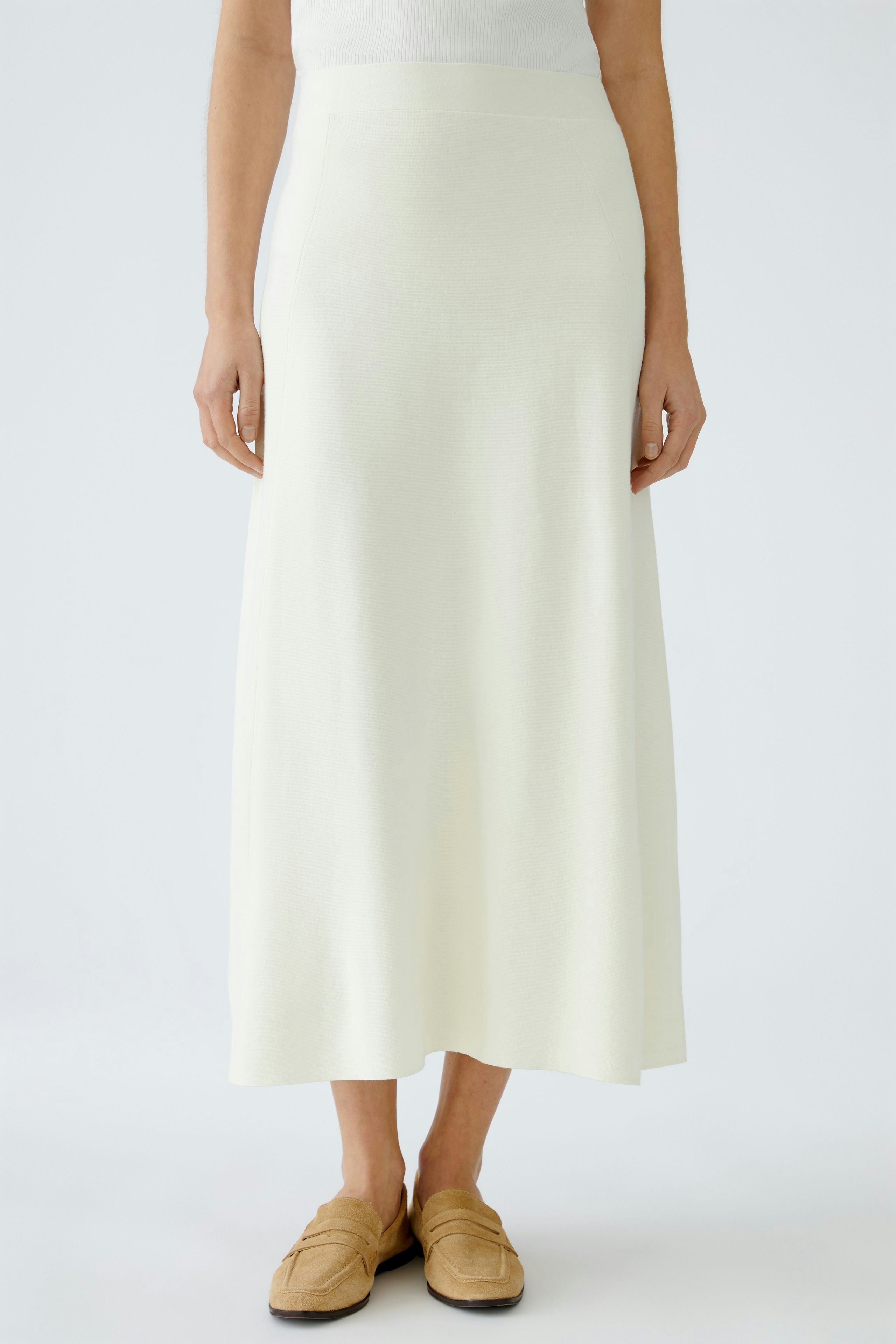 Elegant women's knitted skirt in soft white, perfect for versatile styling.
