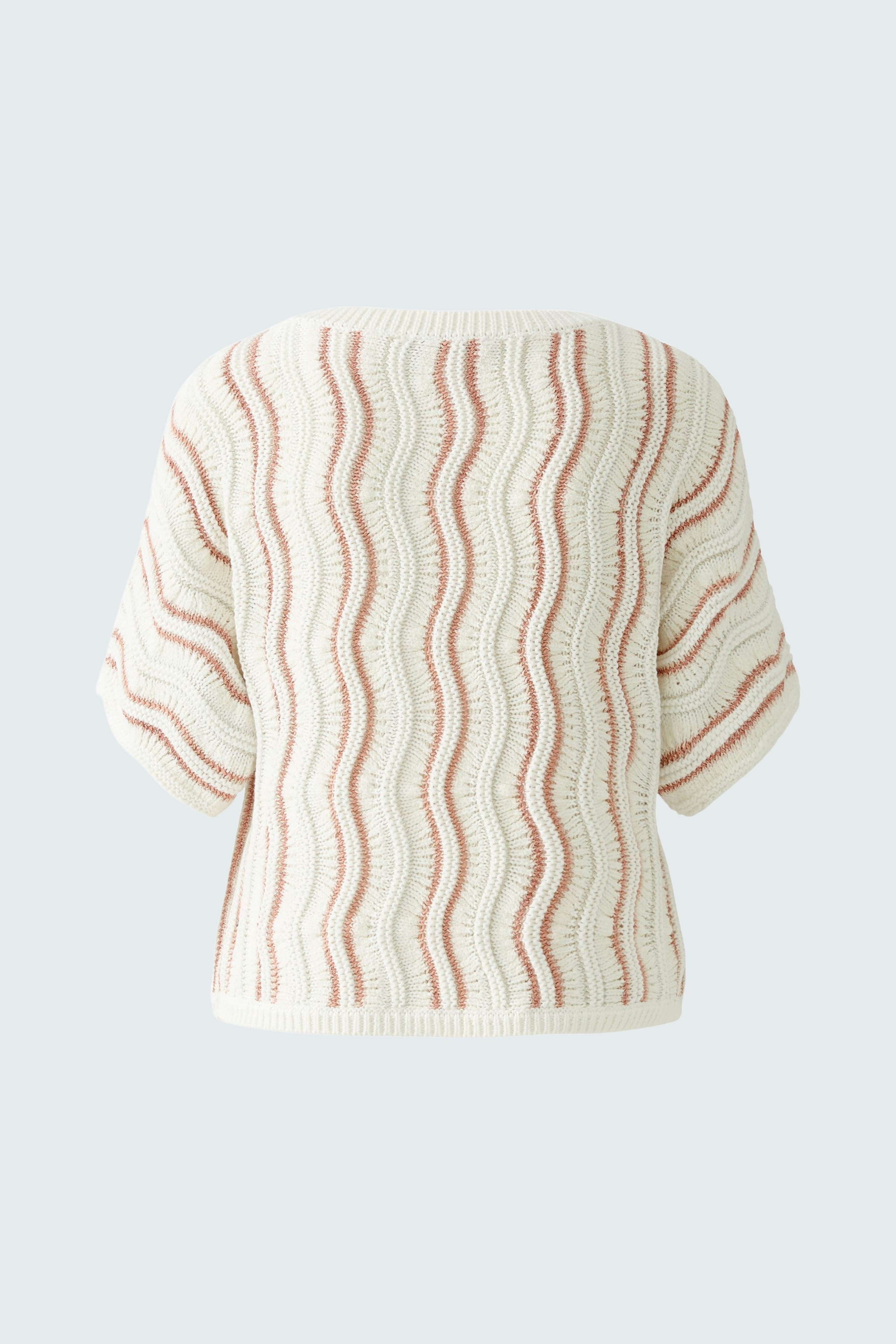 Stylish women's pullover with a wavy pattern in soft cream and coral colors.