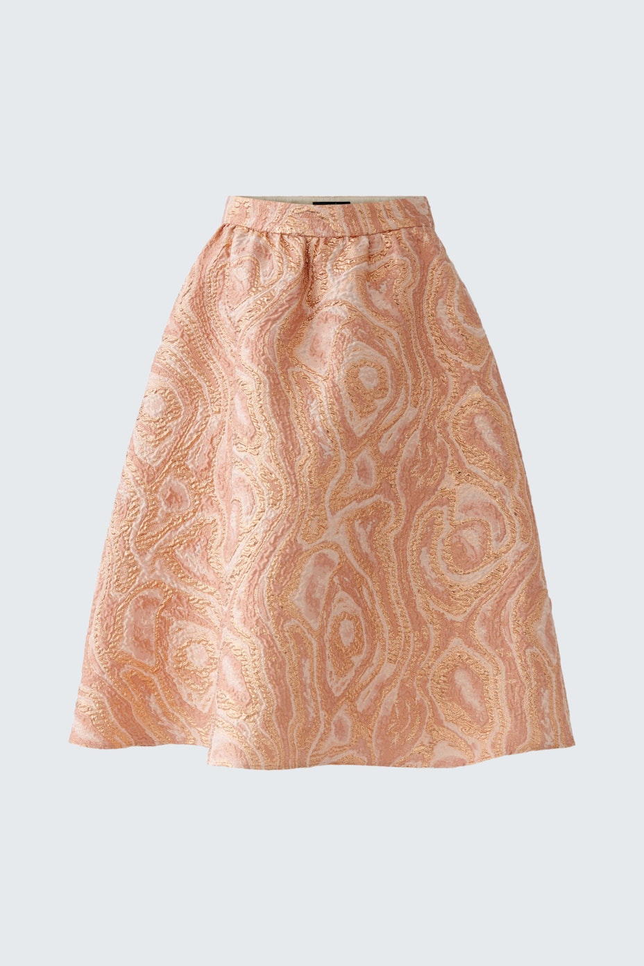 Elegant mid-length skirt in soft peach with a subtle pattern, perfect for stylish occasions.