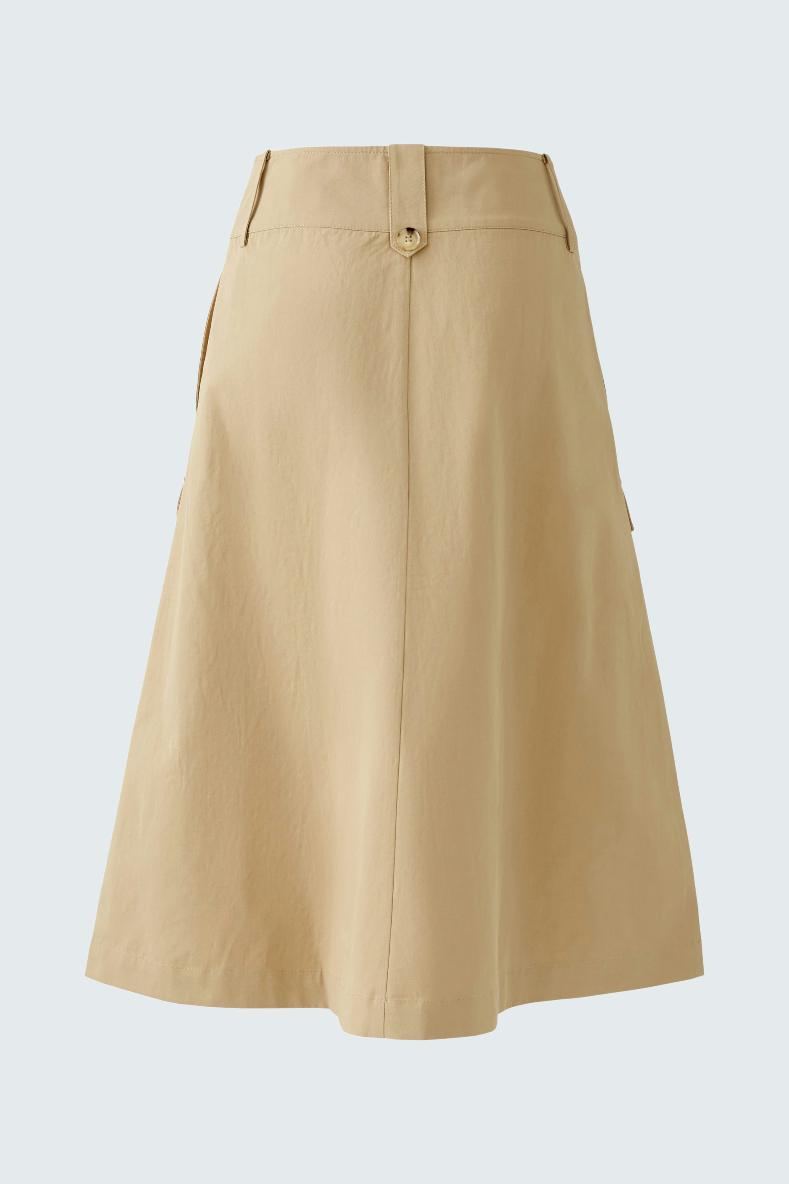 Elegant wrap skirt in soft beige, perfect for versatile styling and comfortable wear.