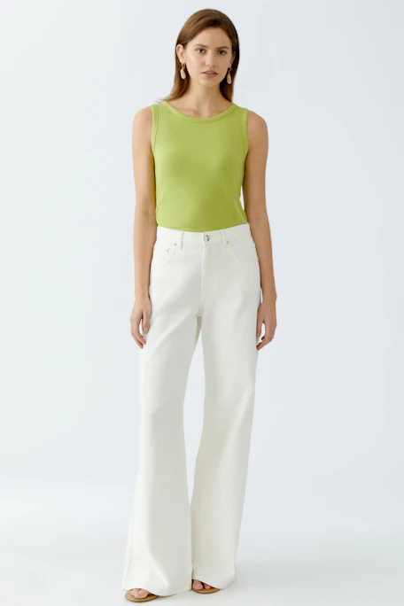 Stylish women's top in vibrant green, perfect for casual or layered looks.