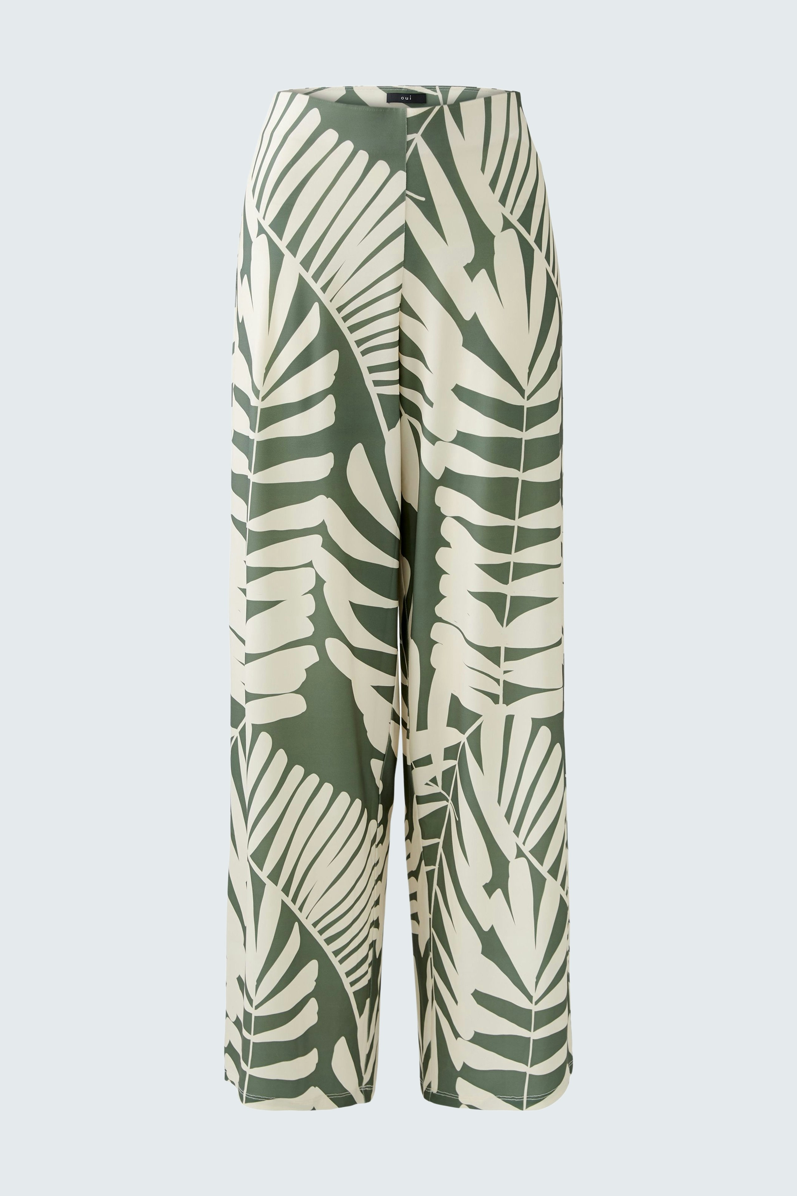 Luftige Damen-Hose mit grün-weißen Blattmustern, ideal für einen entspannten Sommerlook.