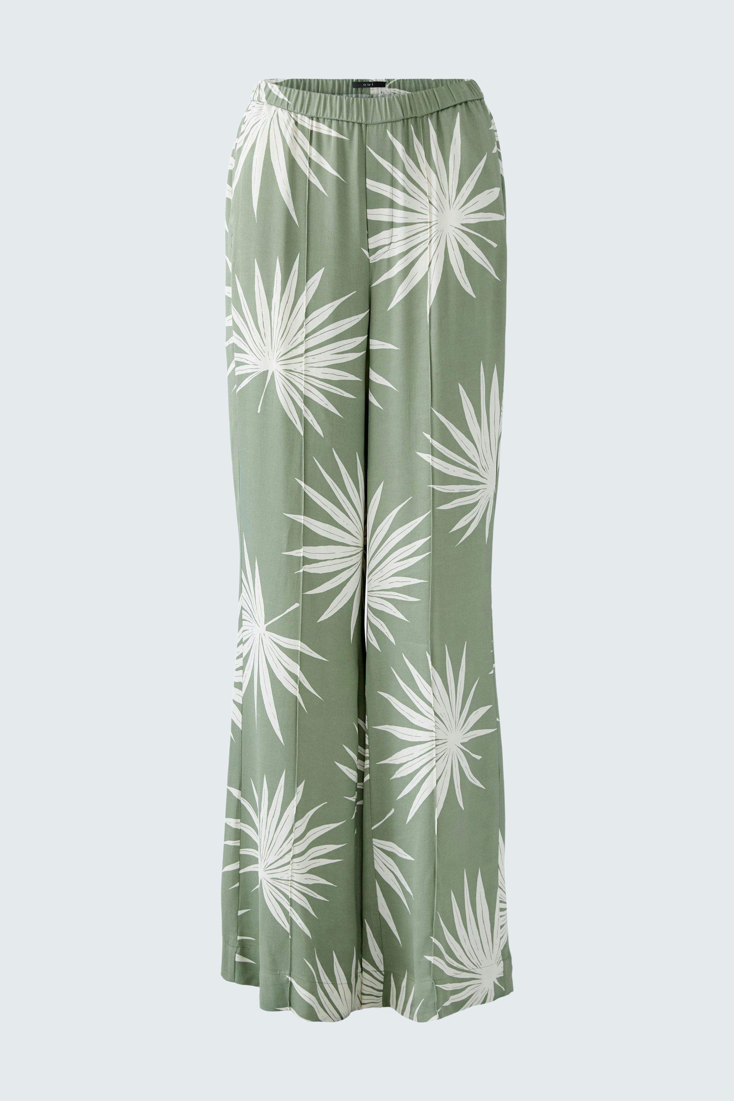 Luftige Damen-Hose mit grünem Blattmuster, ideal für warme Tage und lässige Anlässe.