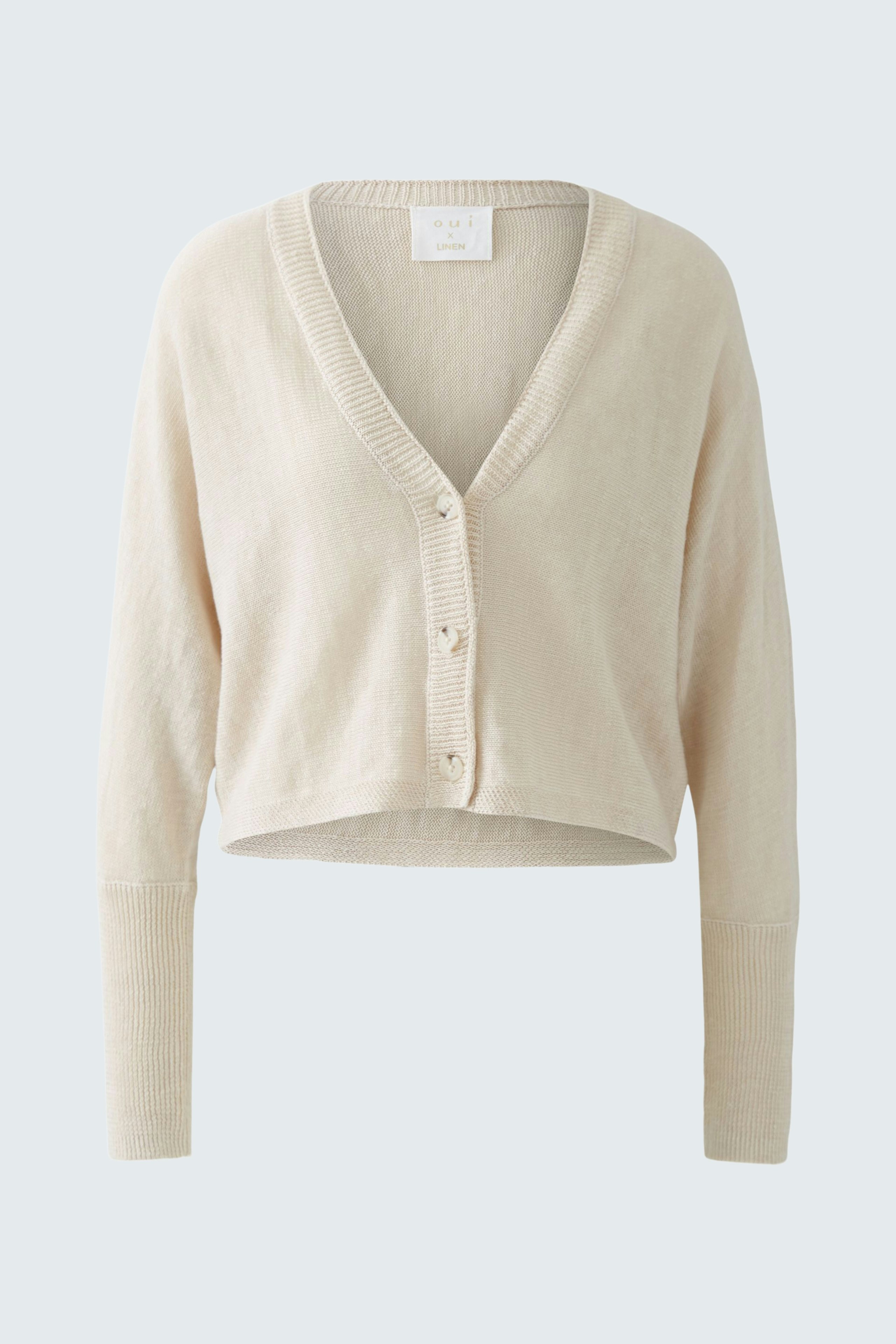 Stylish women's cardigan: Light beige cropped cardigan with buttons, perfect for layering.