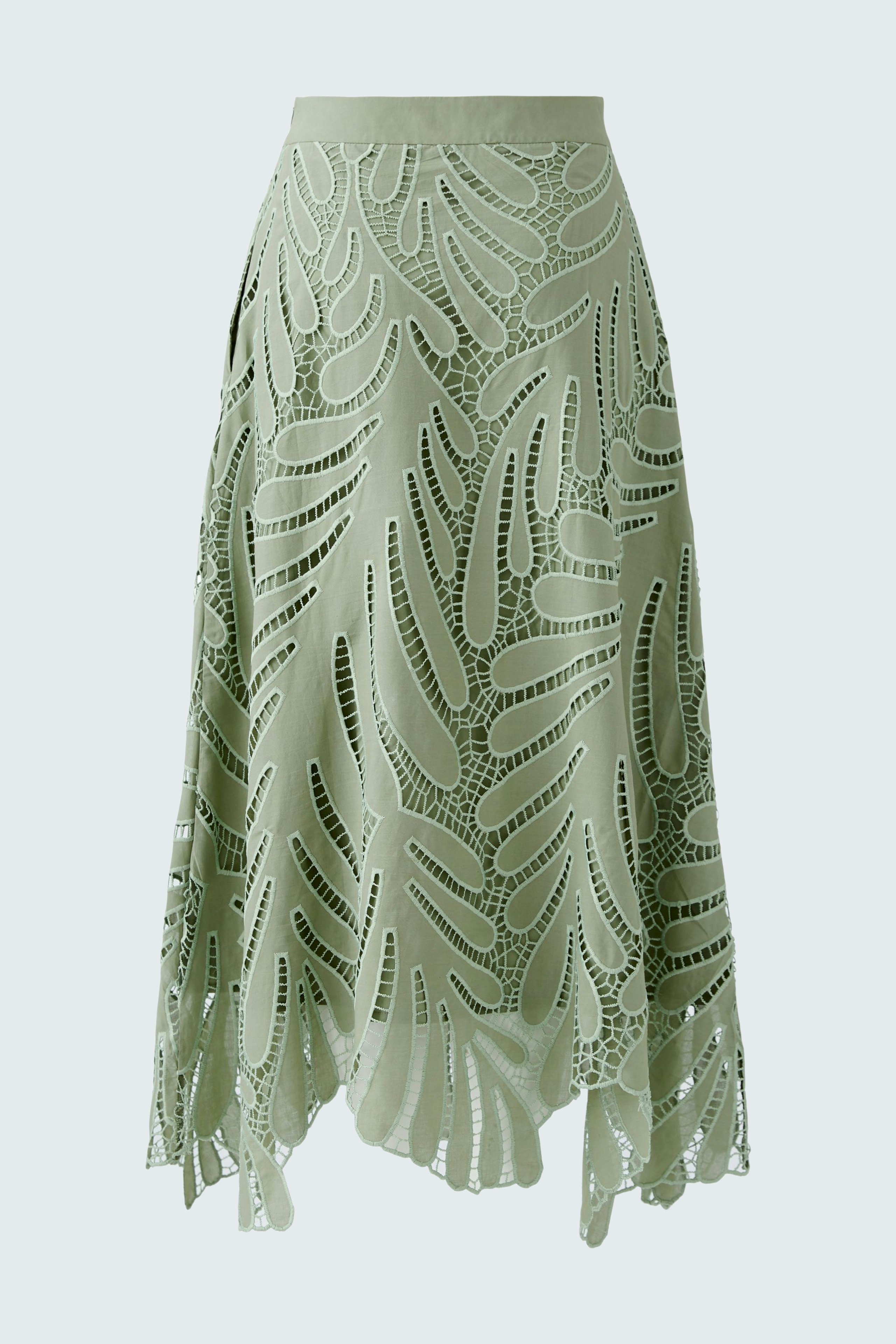 Elegant A-line skirt in light green with intricate cut-out design, perfect for stylish summer outfits.