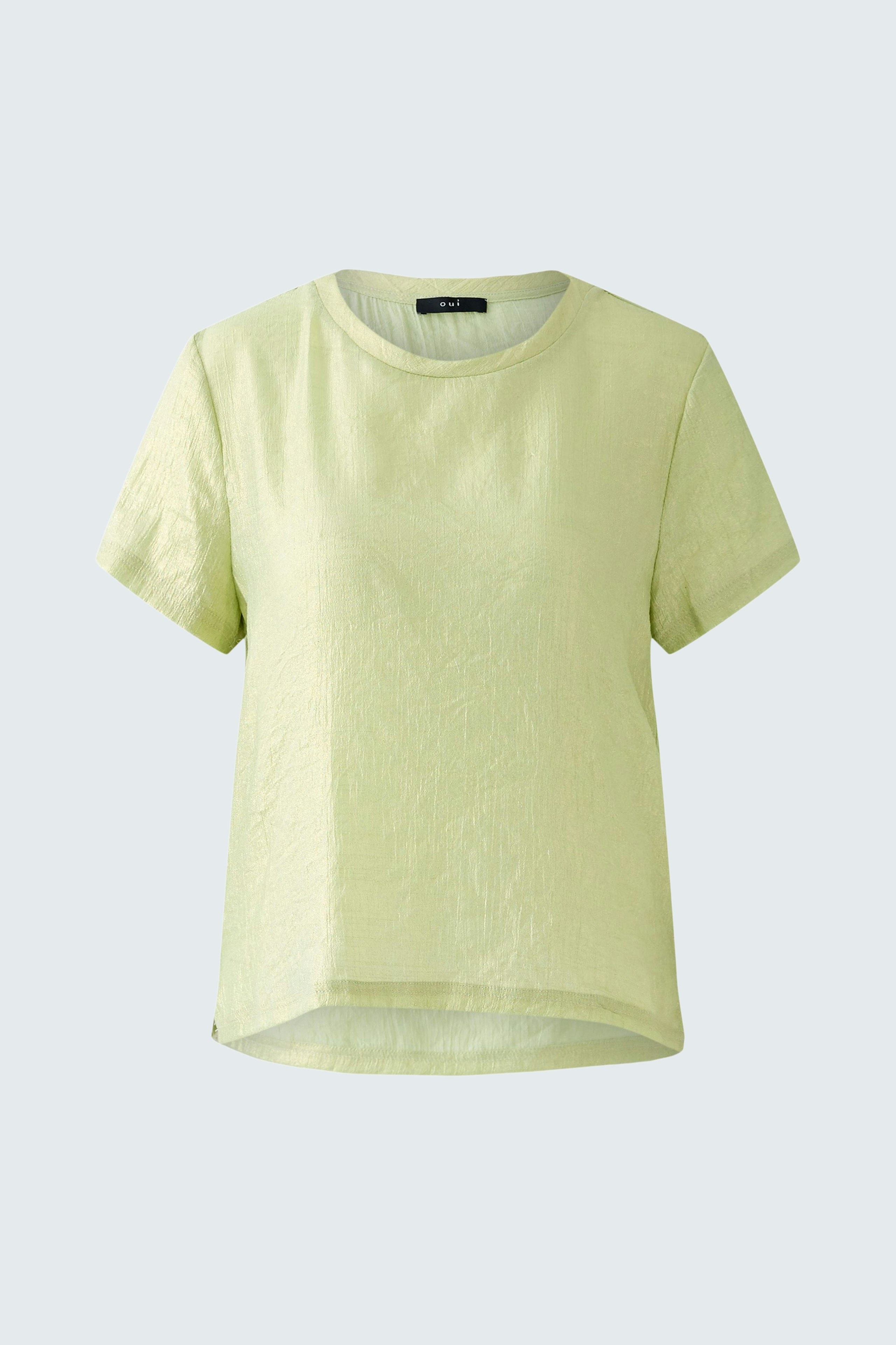 Light green blouse with a relaxed fit, perfect for casual summer outfits.