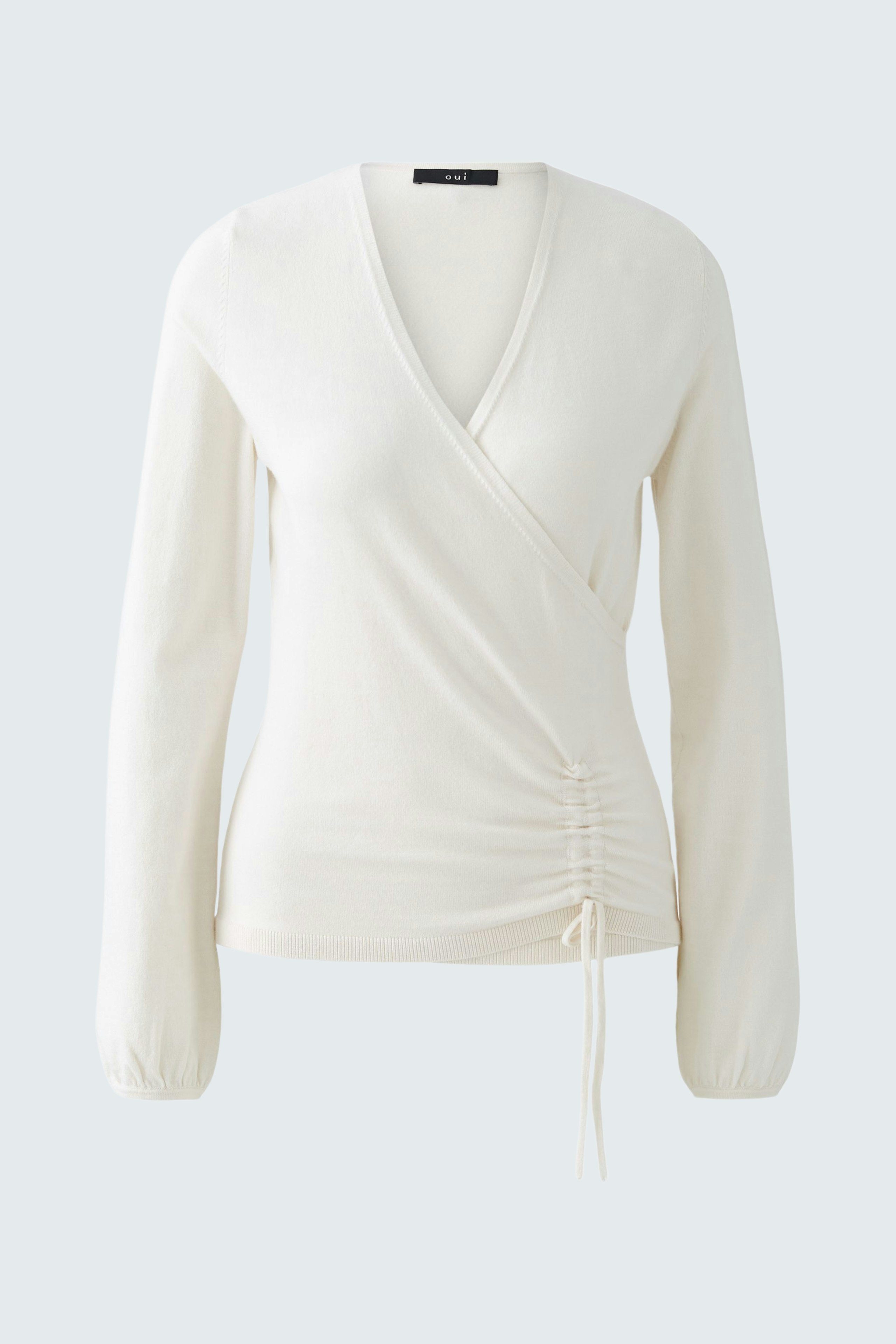 Elegant women's pullover in soft cream with a wrap design and gathered detail at the waist.
