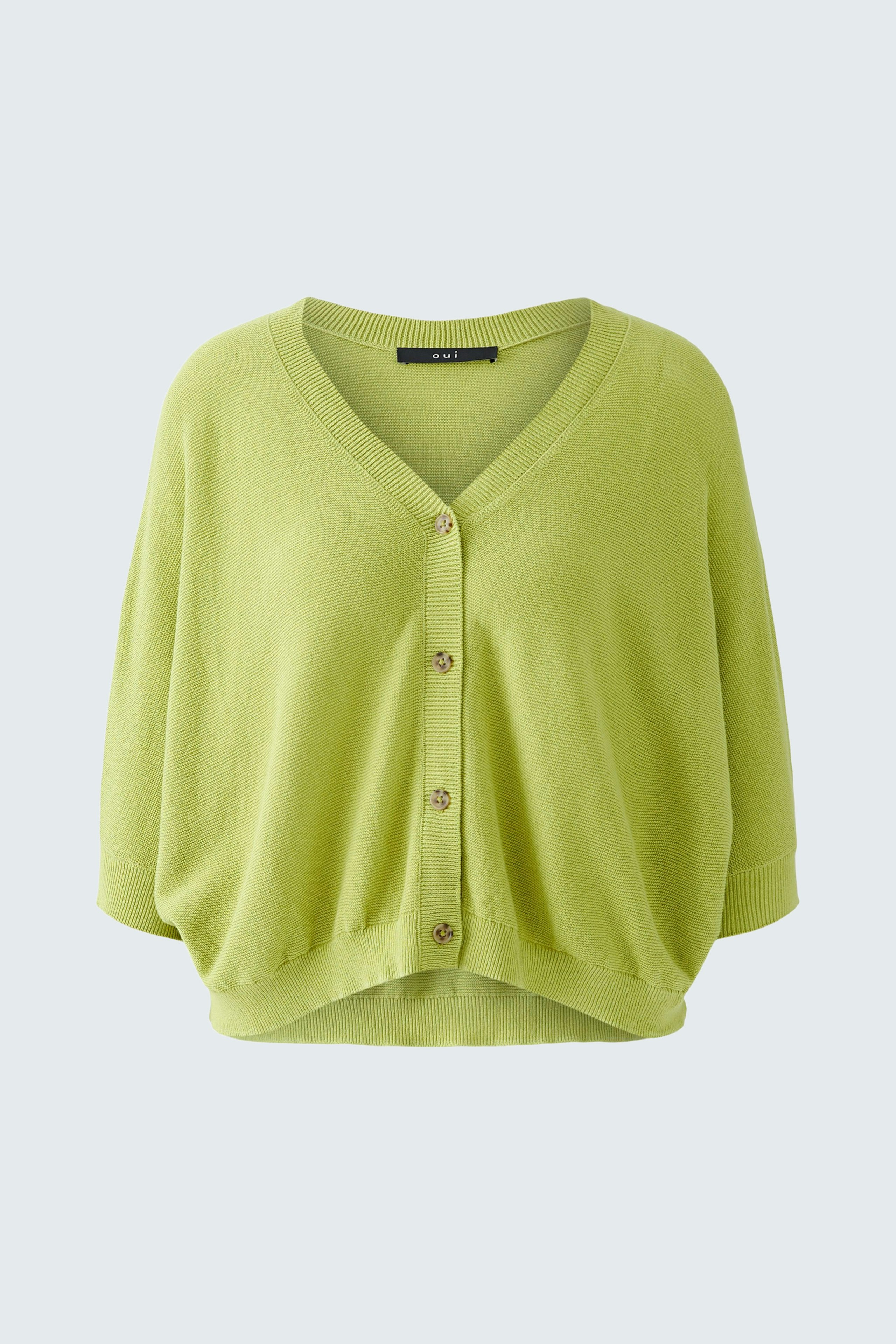 Light green cardigan: A stylish women's cardigan with a relaxed fit and button closure.