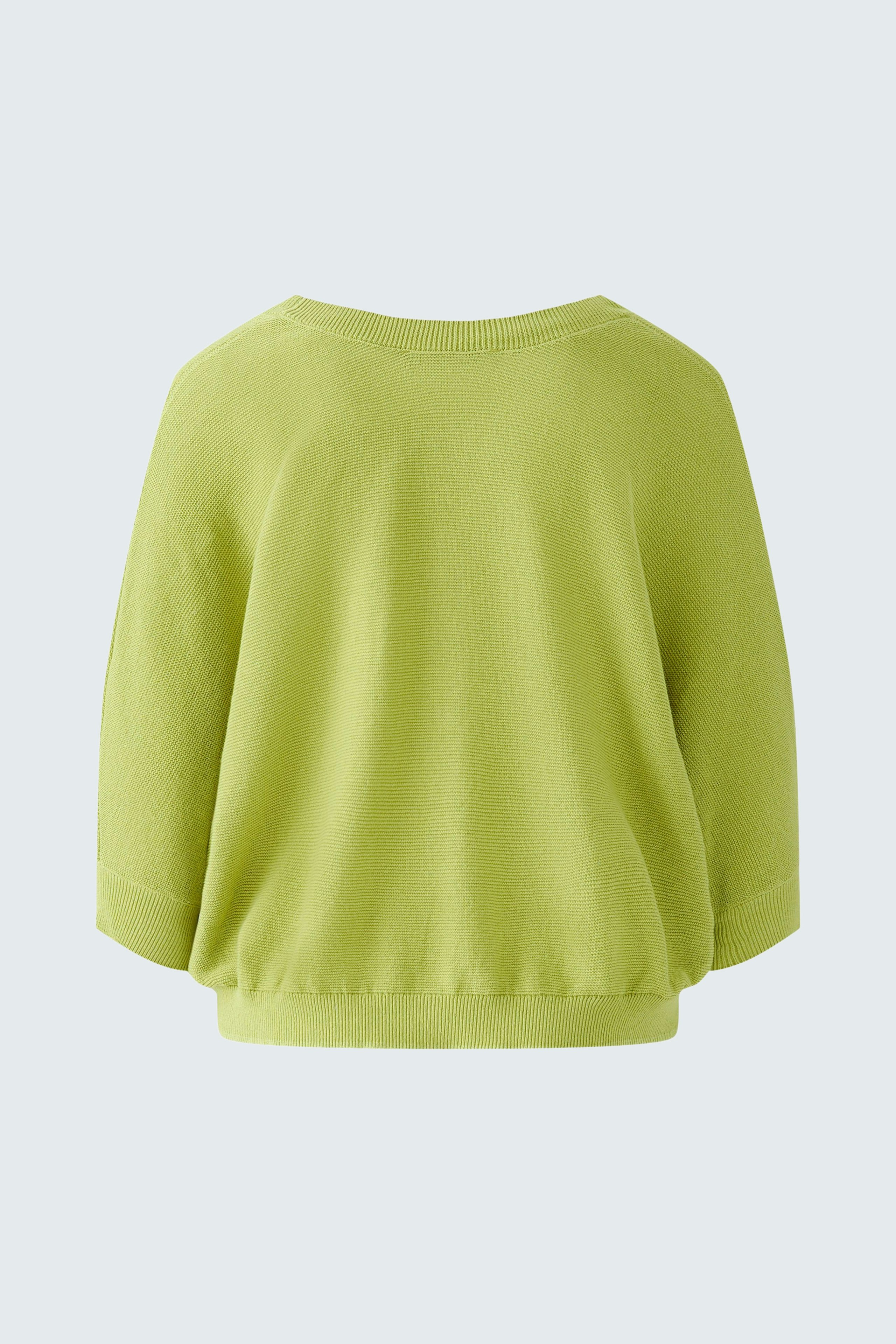 Stylish women's cardigan in vibrant green, featuring a relaxed fit and soft texture.