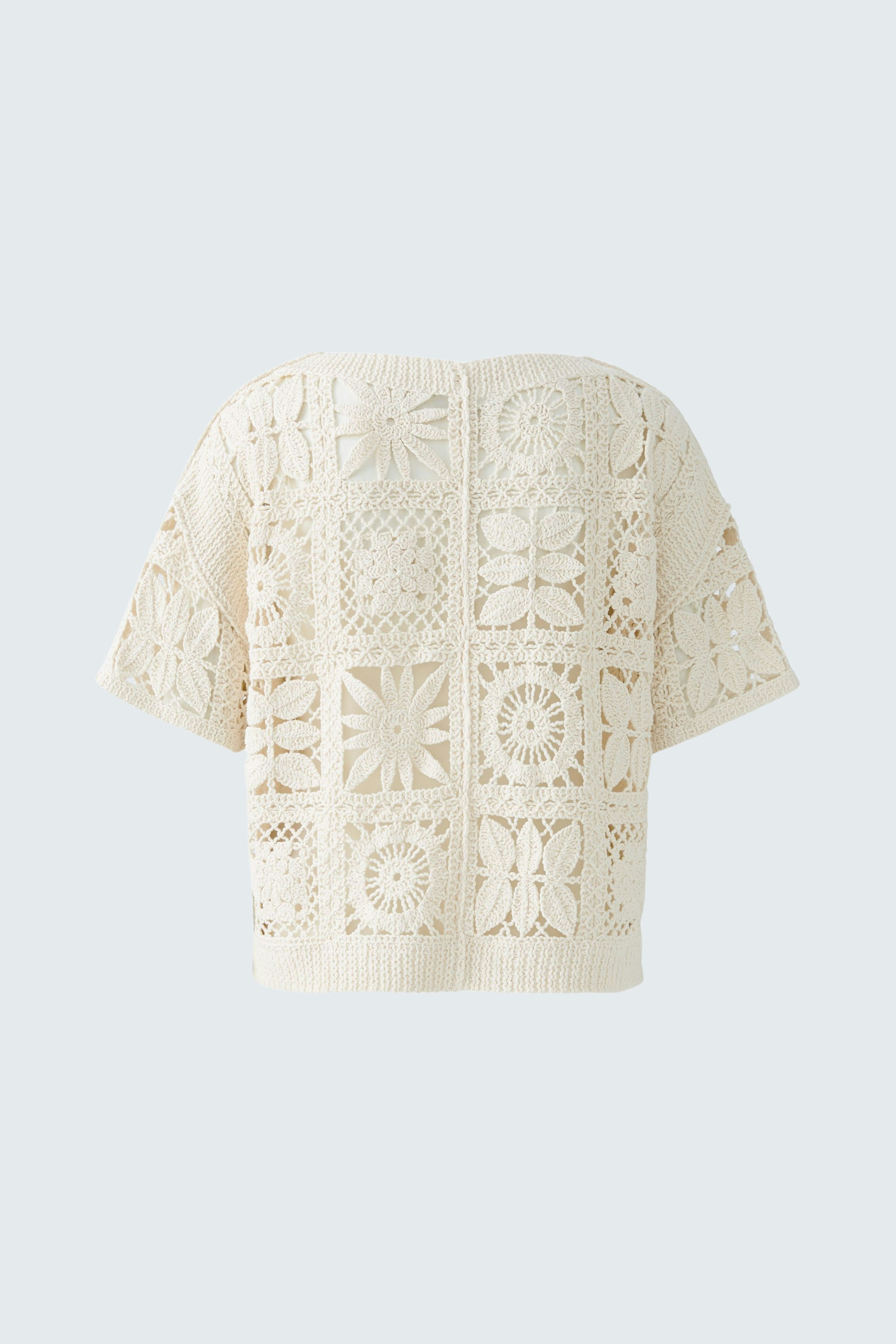 Stylish women's pullover: Cream-colored, intricately designed knit with a relaxed fit.