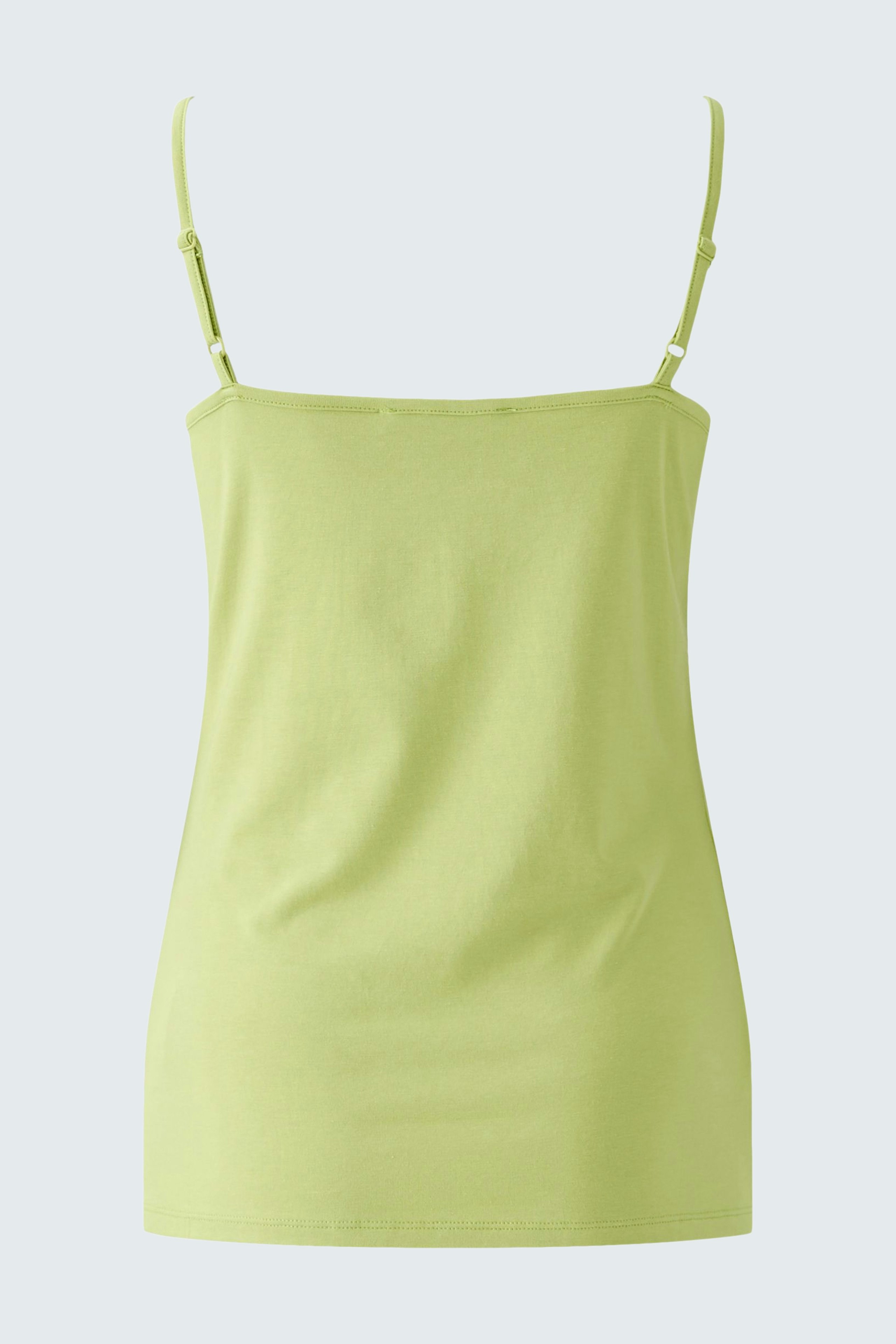 Stylish women's top: Light green tank top with thin straps, perfect for warm days.