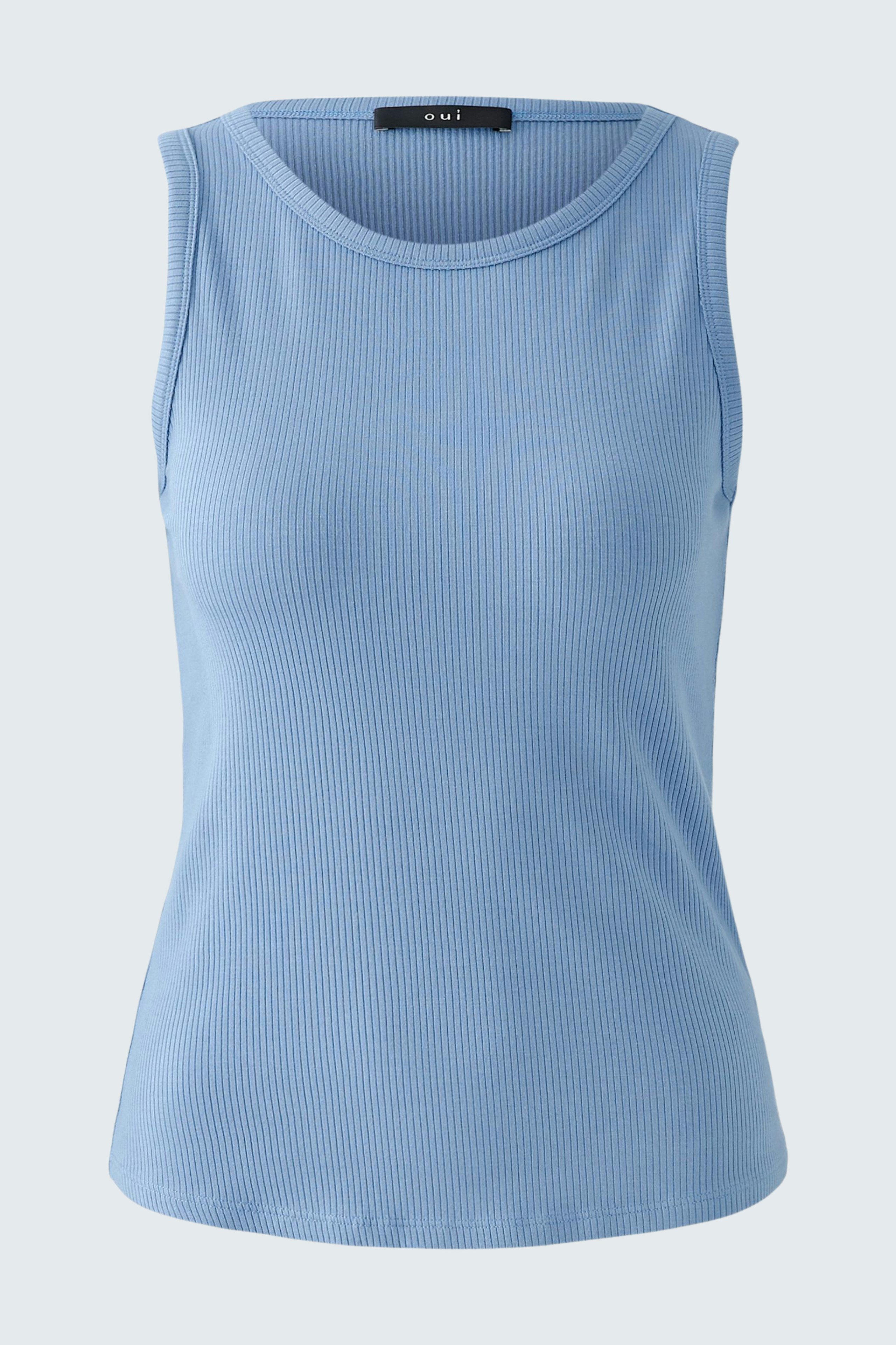 Light blue sleeveless top: A woman in a fitted ribbed top, perfect for casual summer outfits.