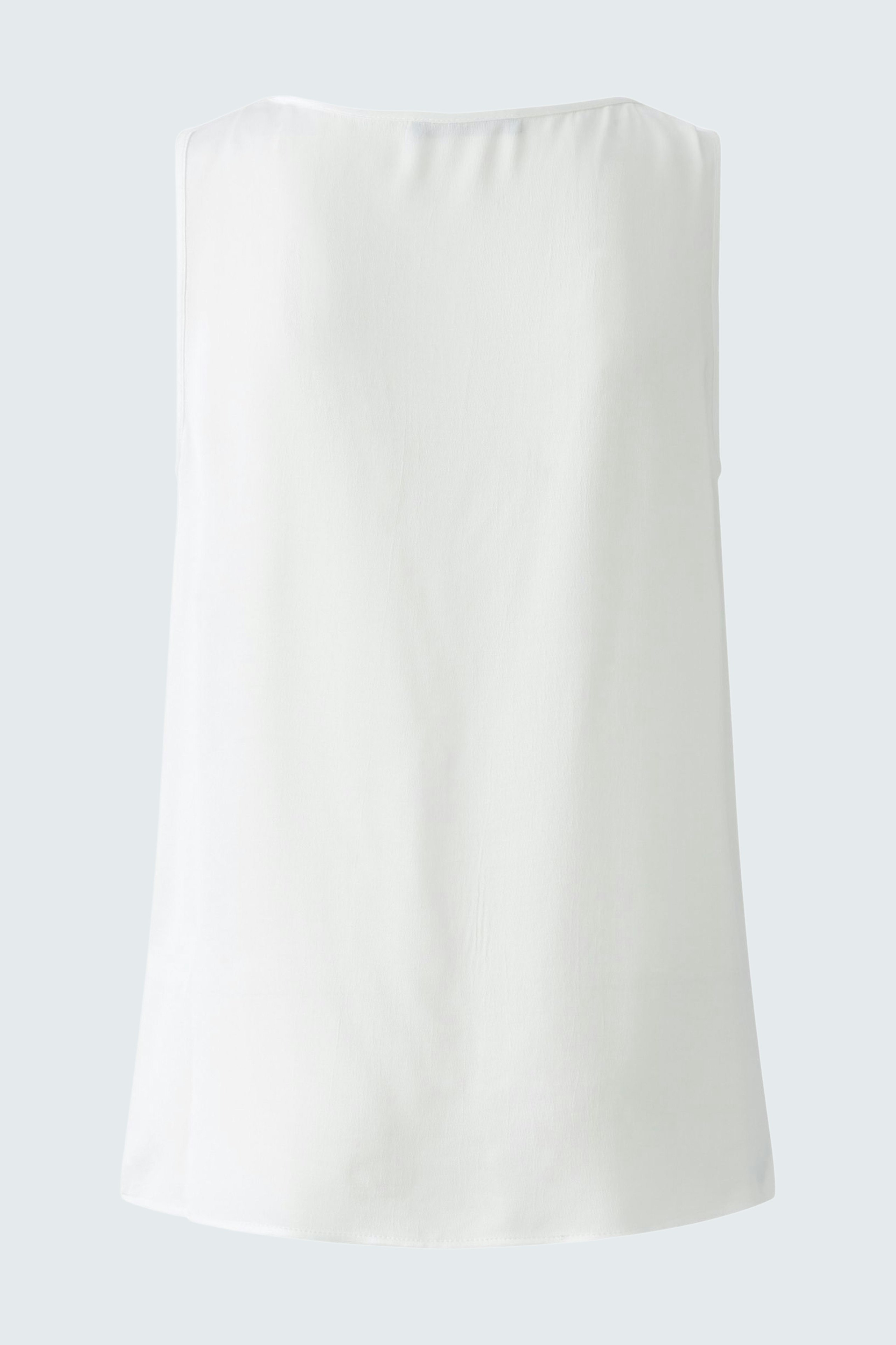 Elegant women's top: A simple white sleeveless design, perfect for layering or wearing alone.
