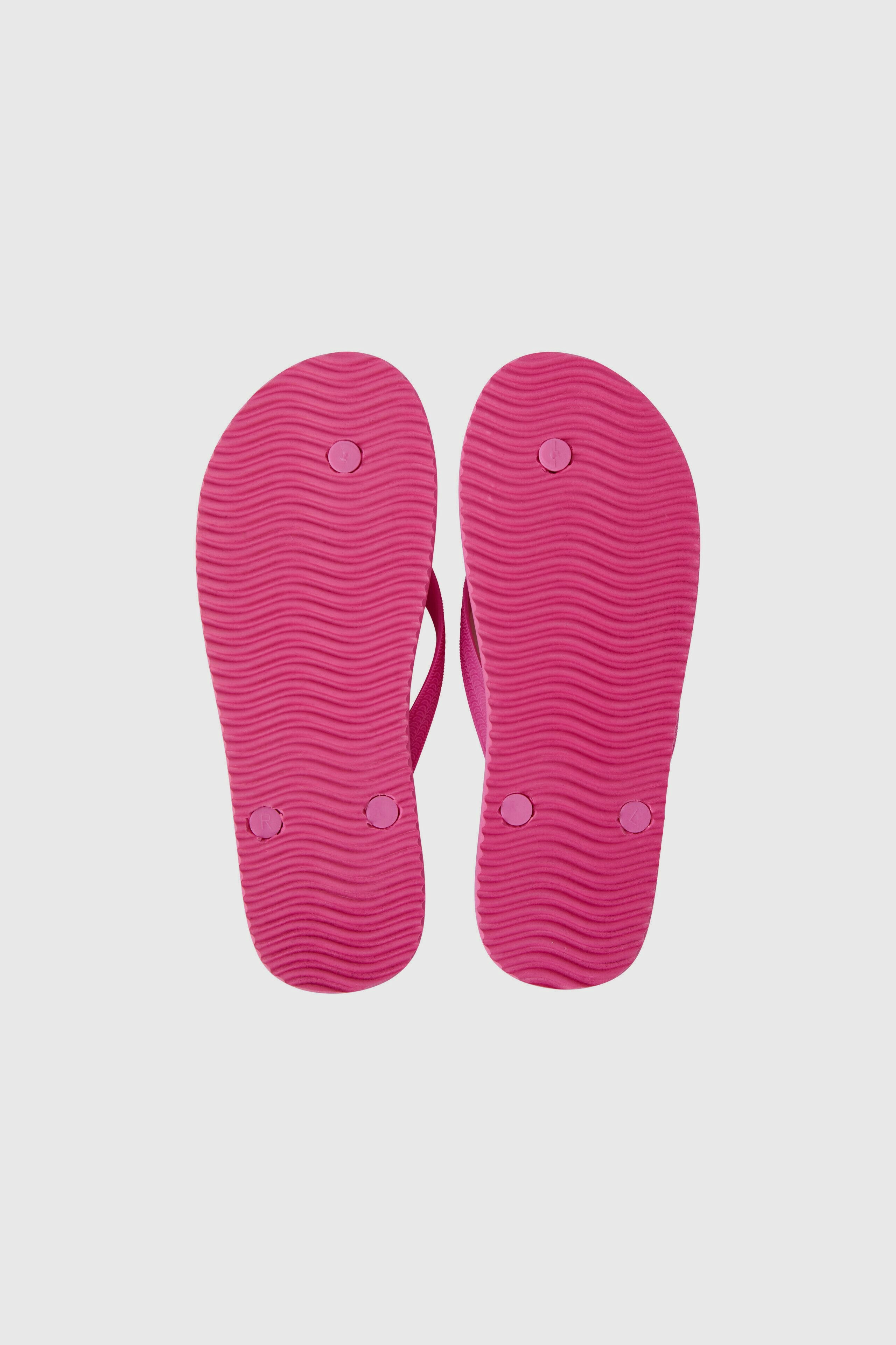 Bequeme Flip Flops in leuchtendem Pink mit rutschfester Sohle für einen lässigen Sommerlook.