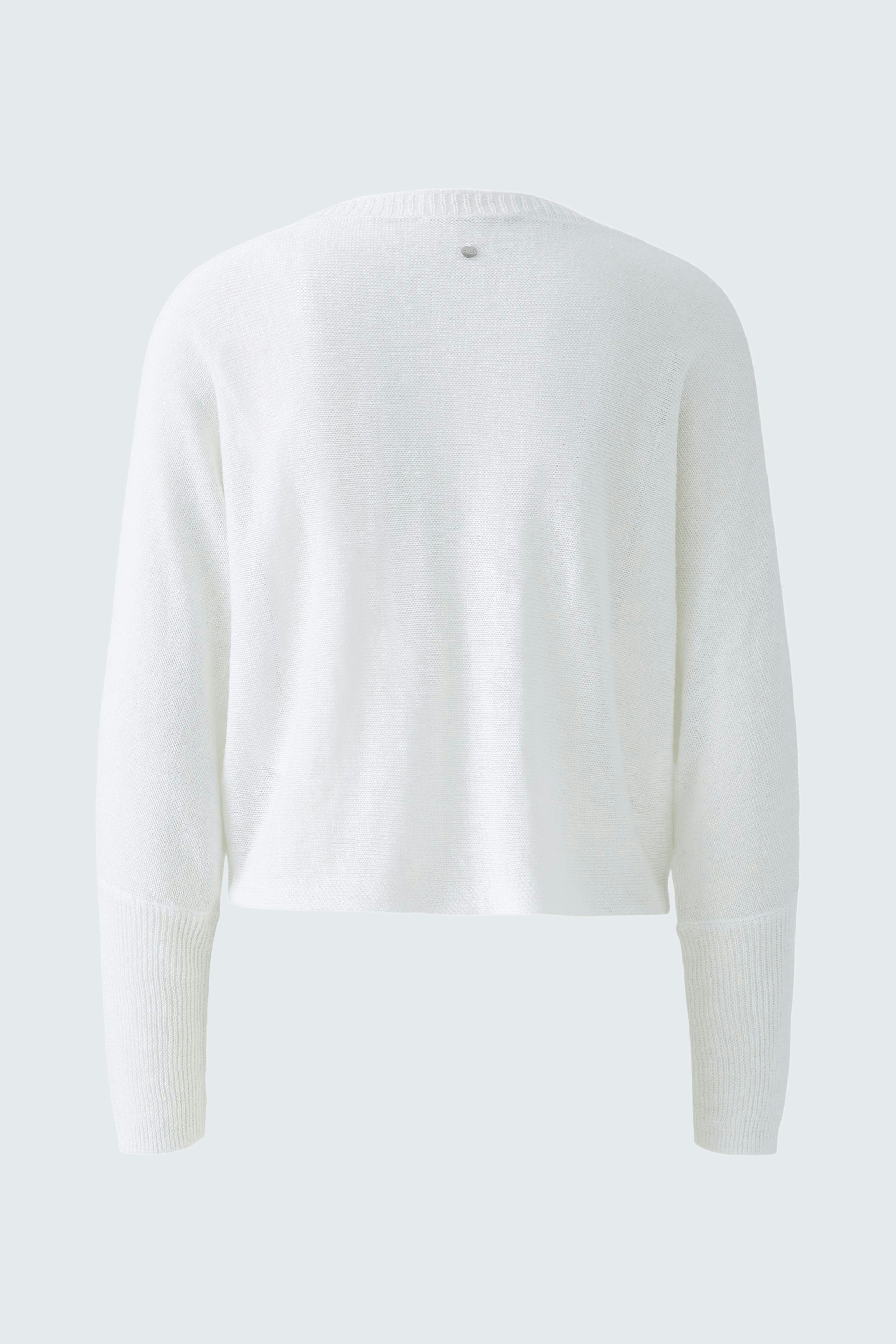 Cozy women's cardigan in soft white, perfect for layering and adding warmth to any outfit.