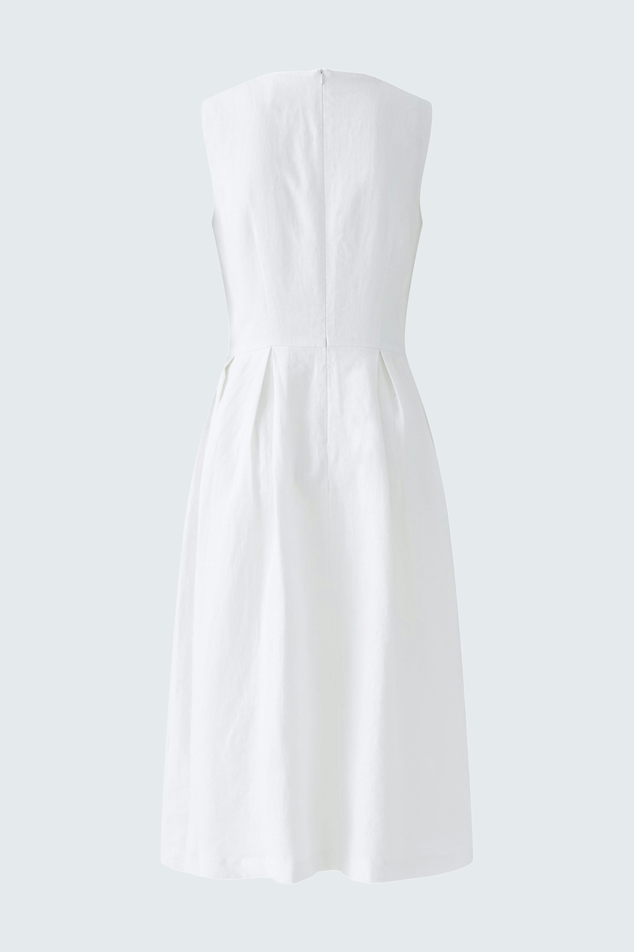 Casual white midi dress: A woman in a simple, sleeveless design with a flowing skirt.