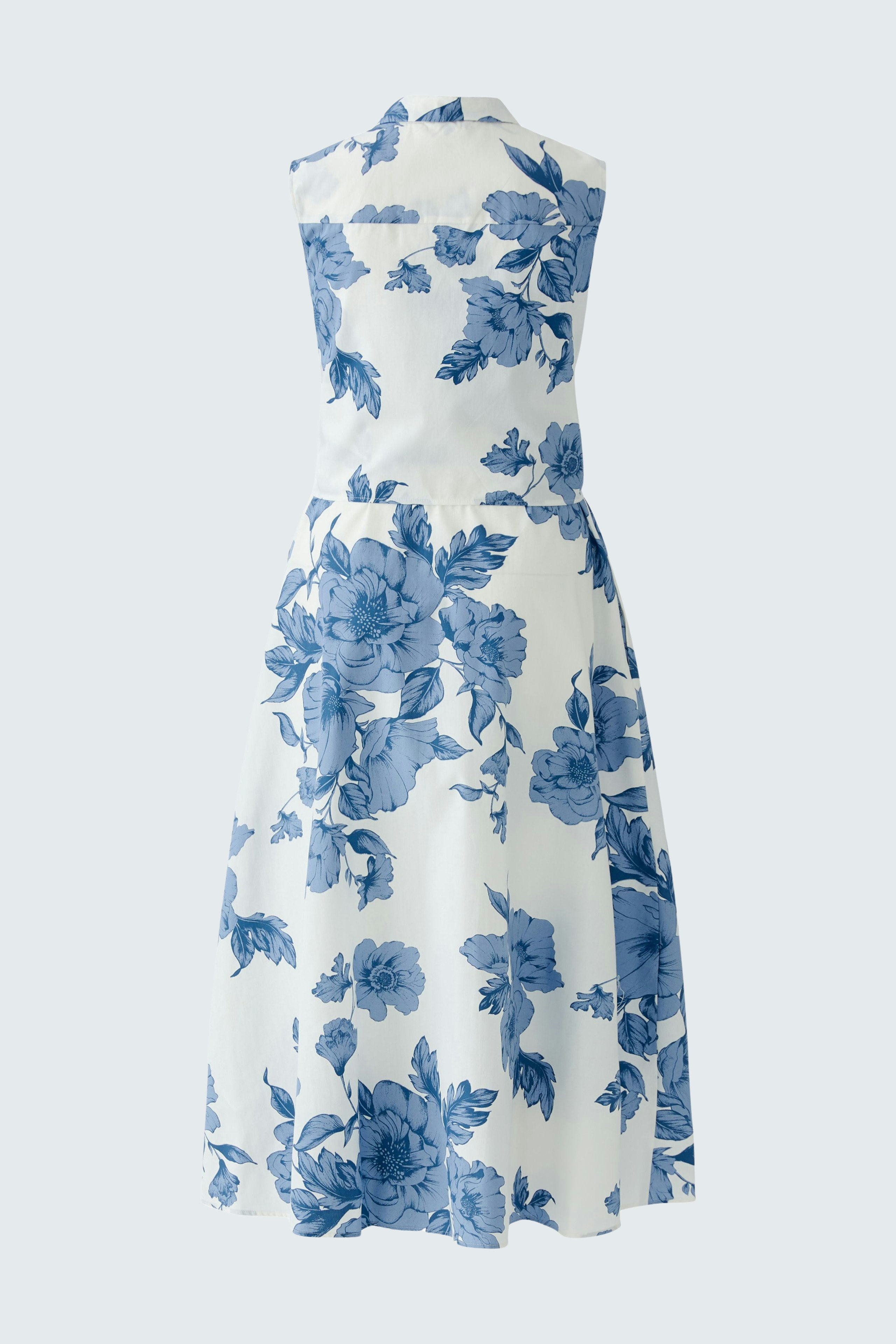 Elegant maxi dress: A woman in a floral-patterned dress with a fitted bodice and flowing skirt.