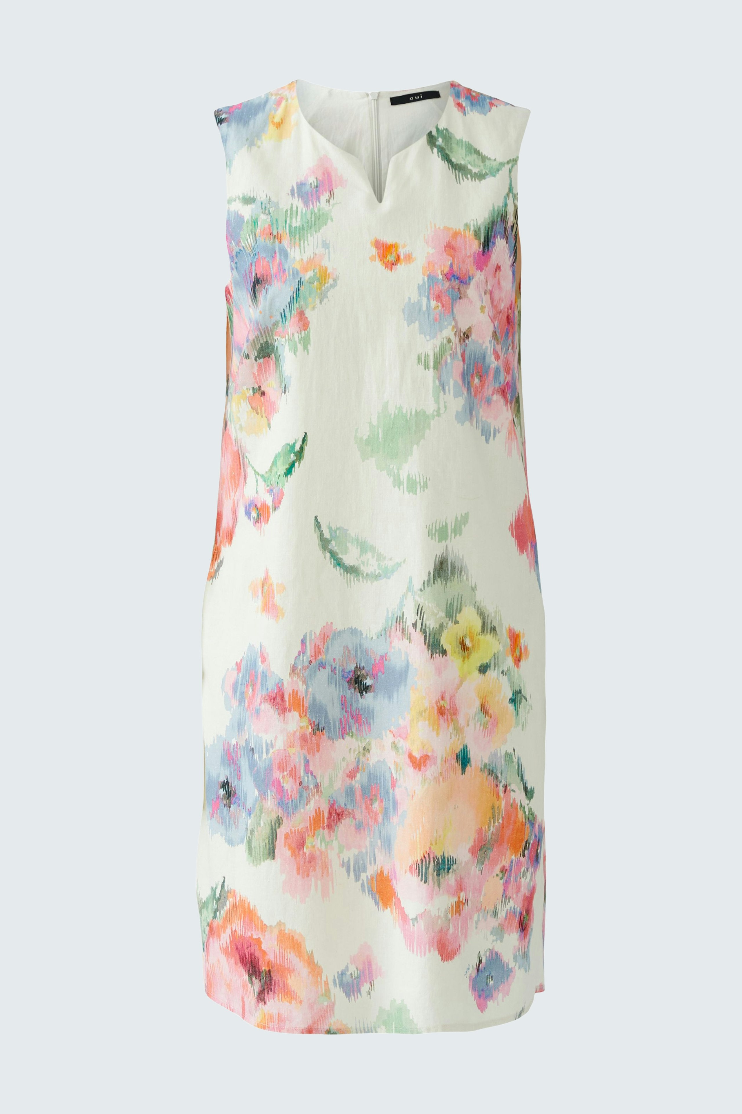 Floral A-line dress: A woman in a sleeveless dress with vibrant flowers, perfect for summer outings.