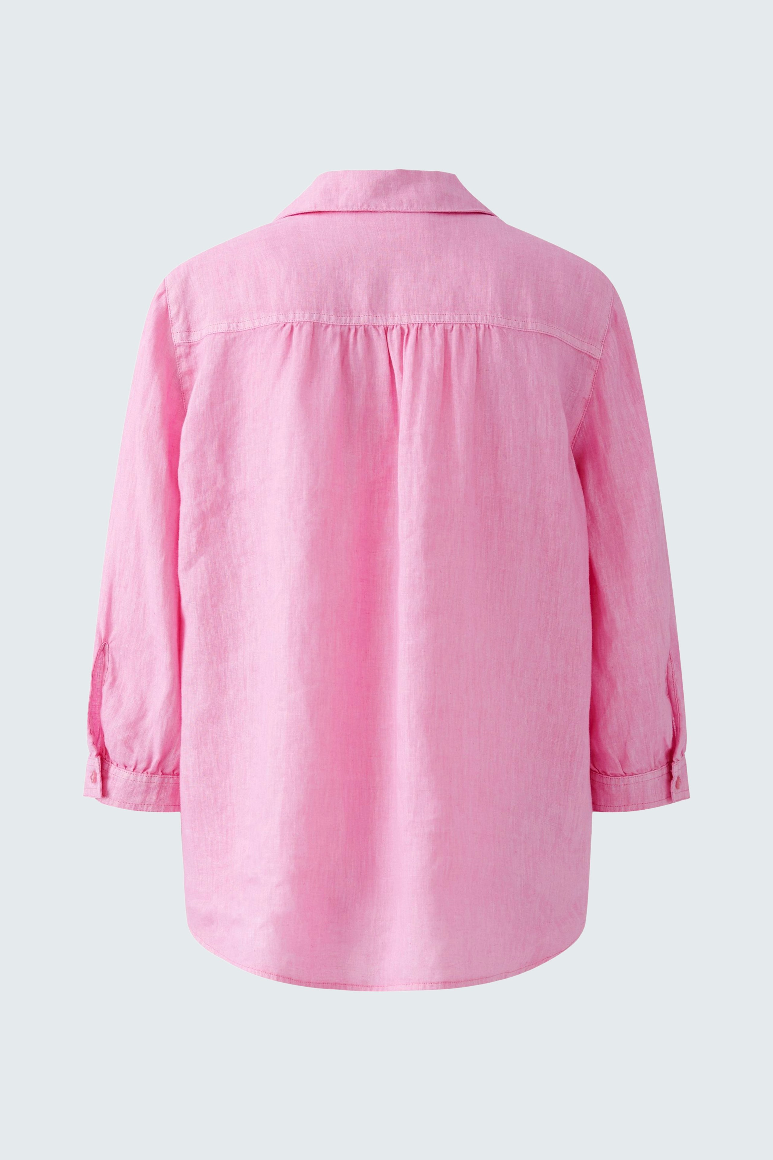 Stylish tunic: A pink women's tunic with a relaxed fit and rolled sleeves, perfect for casual wear.