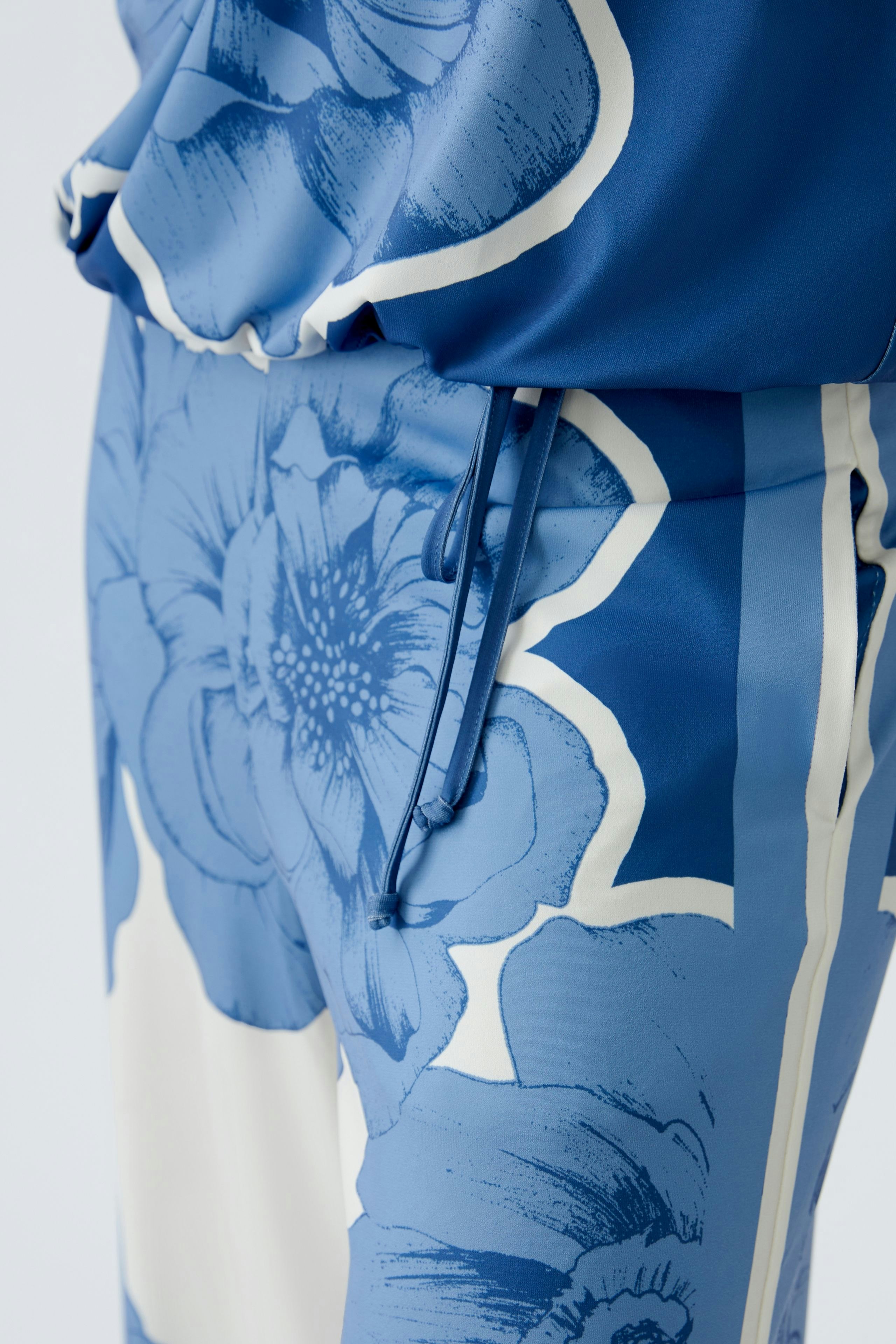 Stylish women's T-shirt in blue floral print, perfect for casual and chic outfits.