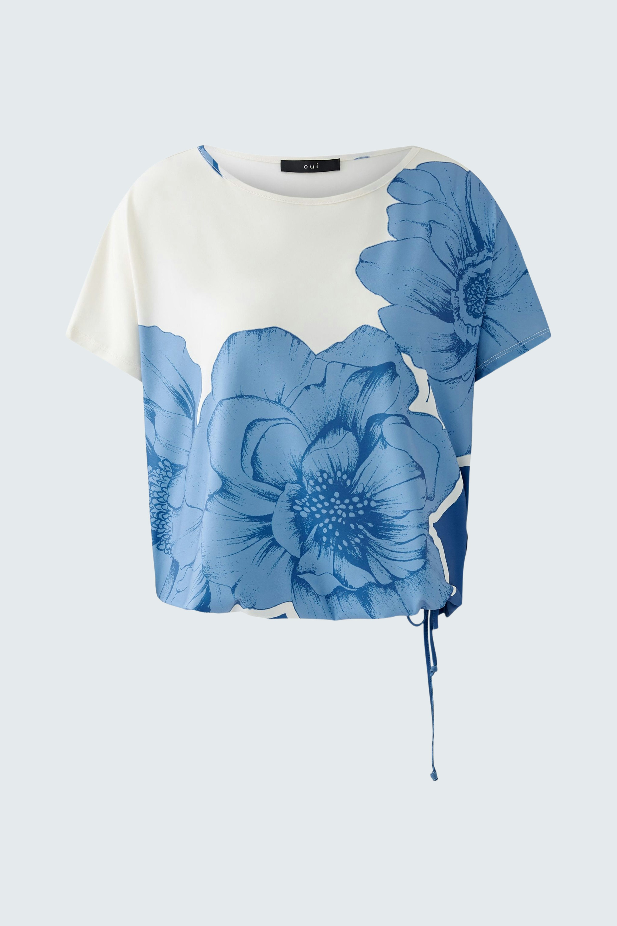 Stylish women's T-shirt with a blue floral design, perfect for casual summer outfits.