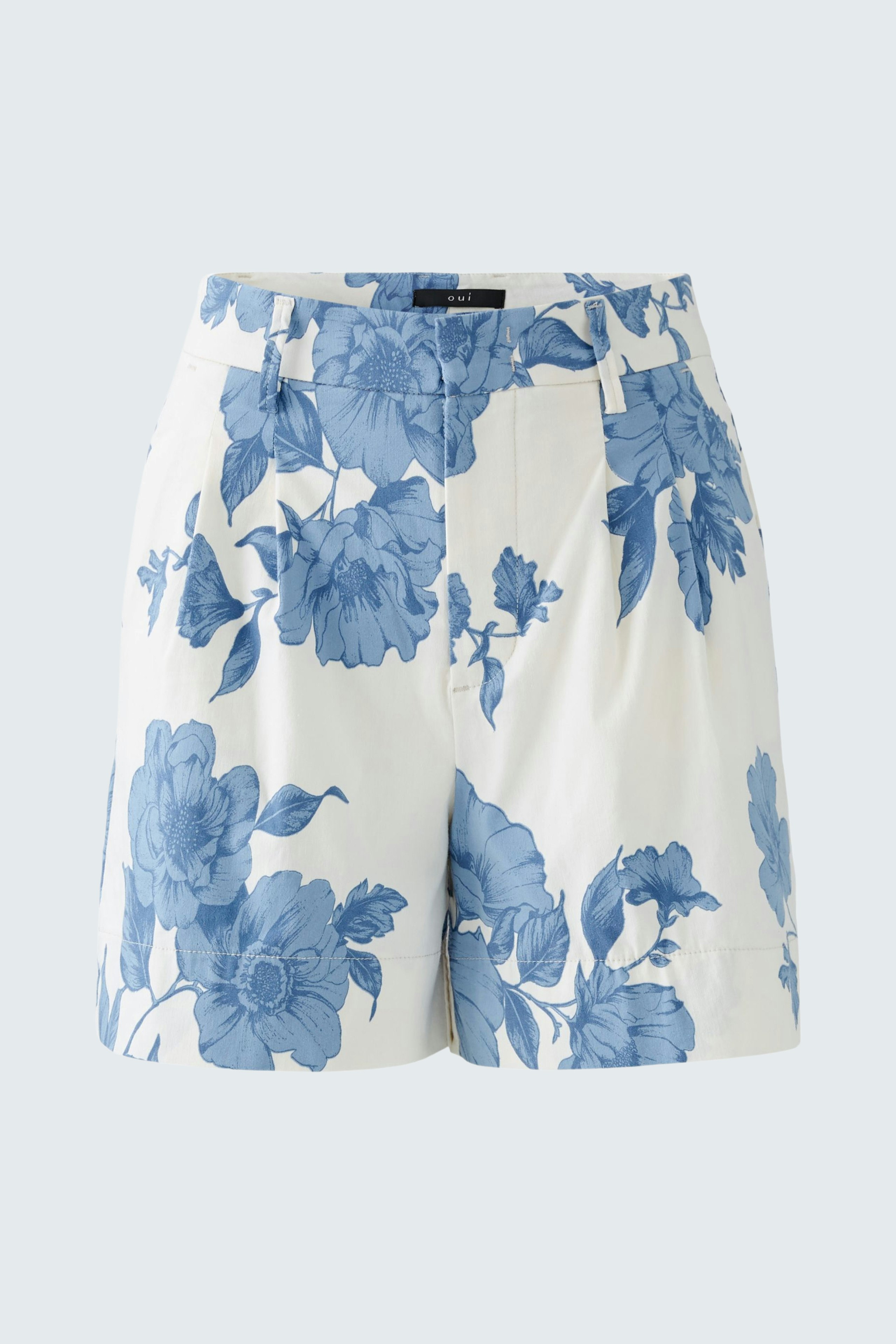 Stylish women's shorts in white with blue floral pattern, perfect for summer outings.
