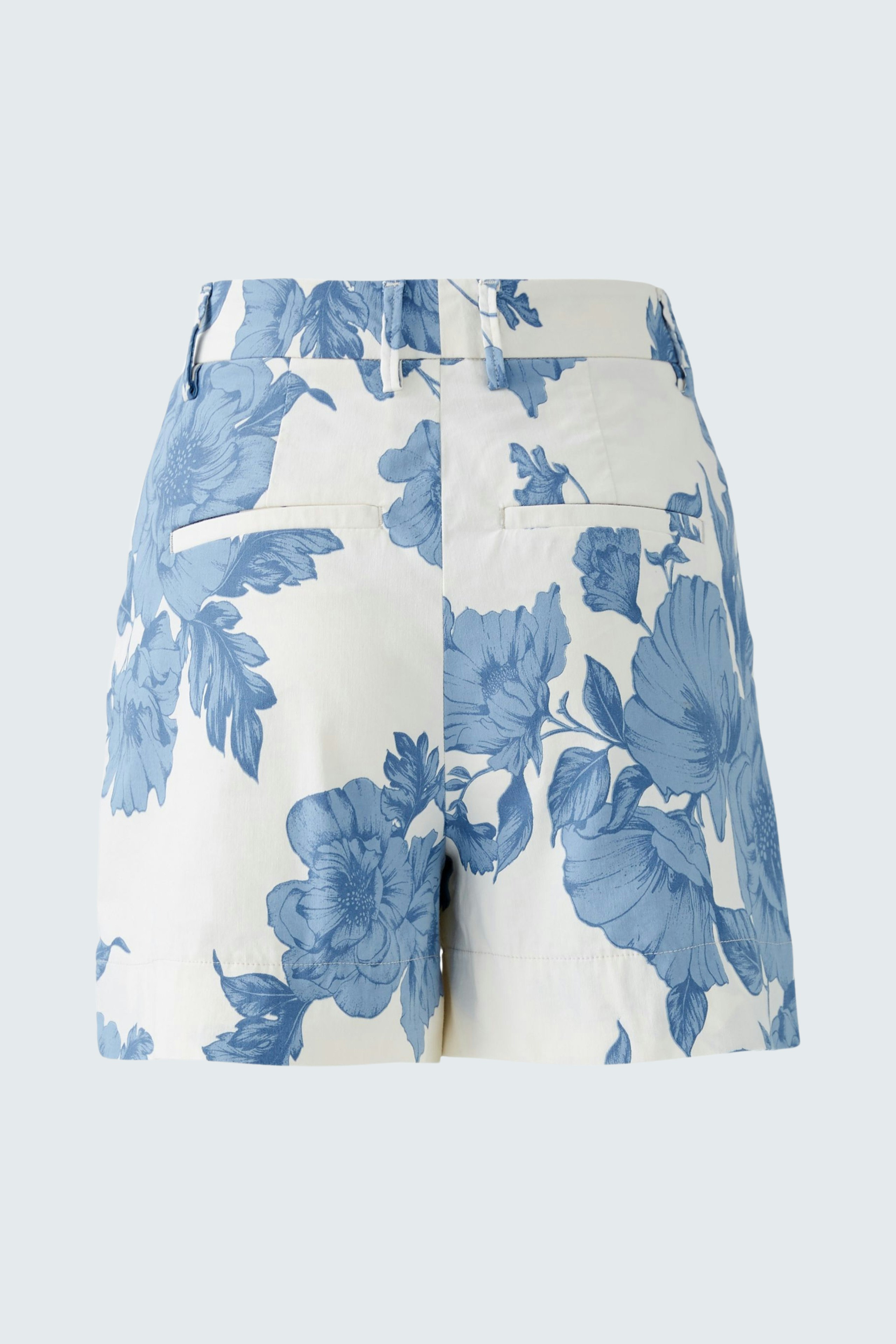 Stylish women's shorts in white with blue floral pattern, perfect for summer outings.