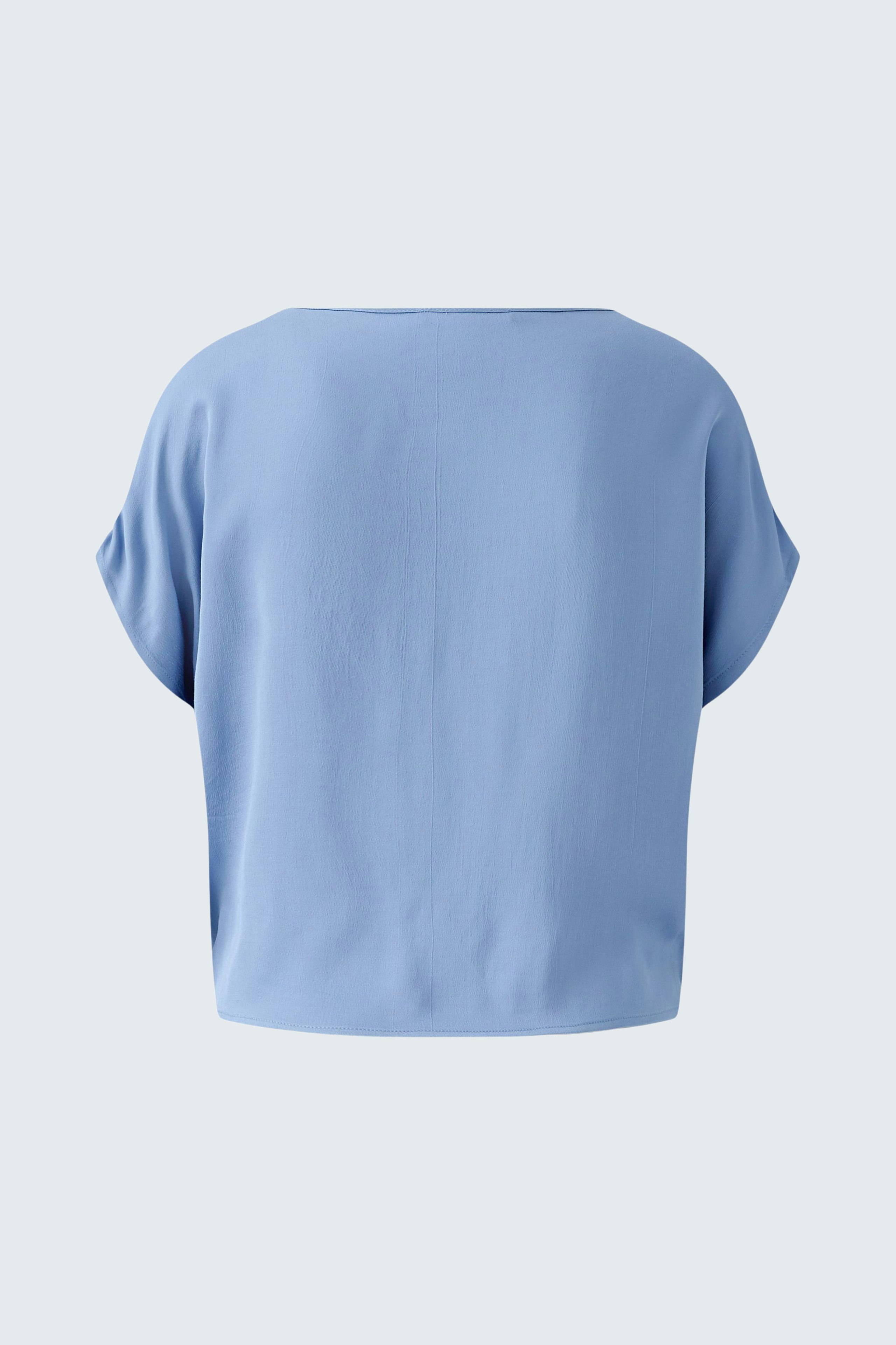 Casual women's blouse in soft blue, featuring a relaxed fit and short sleeves.