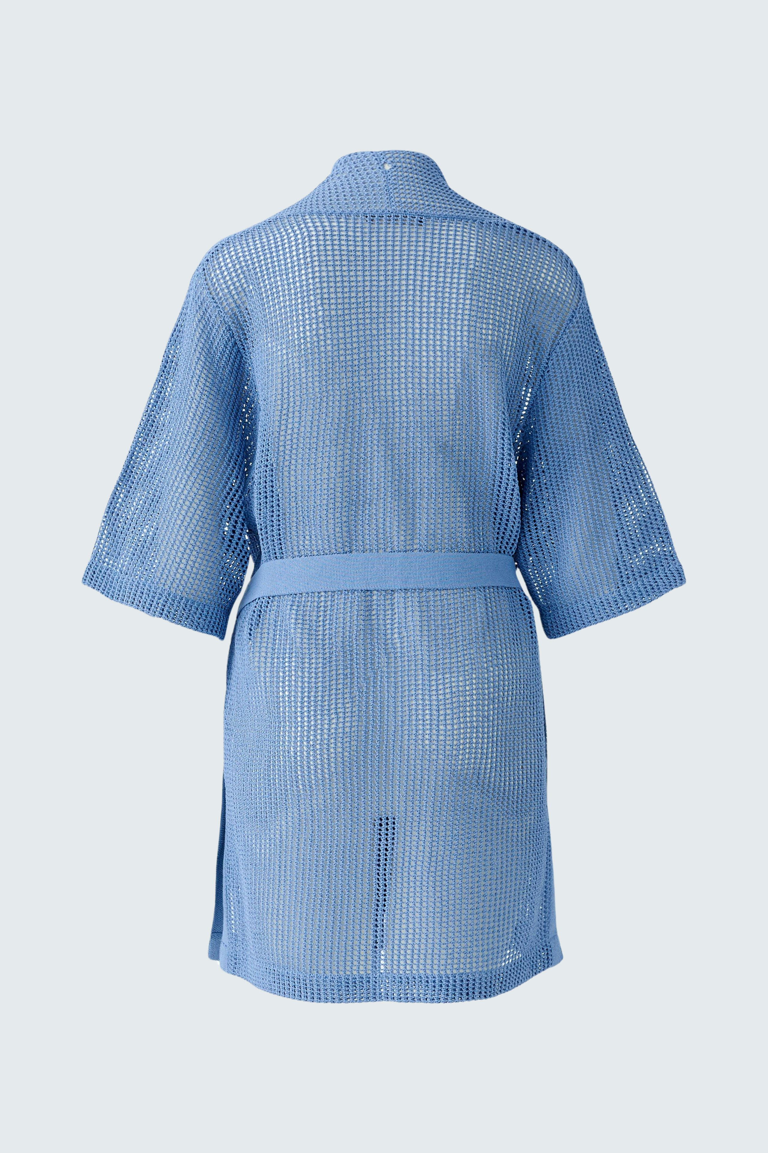 Light blue cardigan: A woman wearing a loose-fitting, breathable cardigan with a belt.