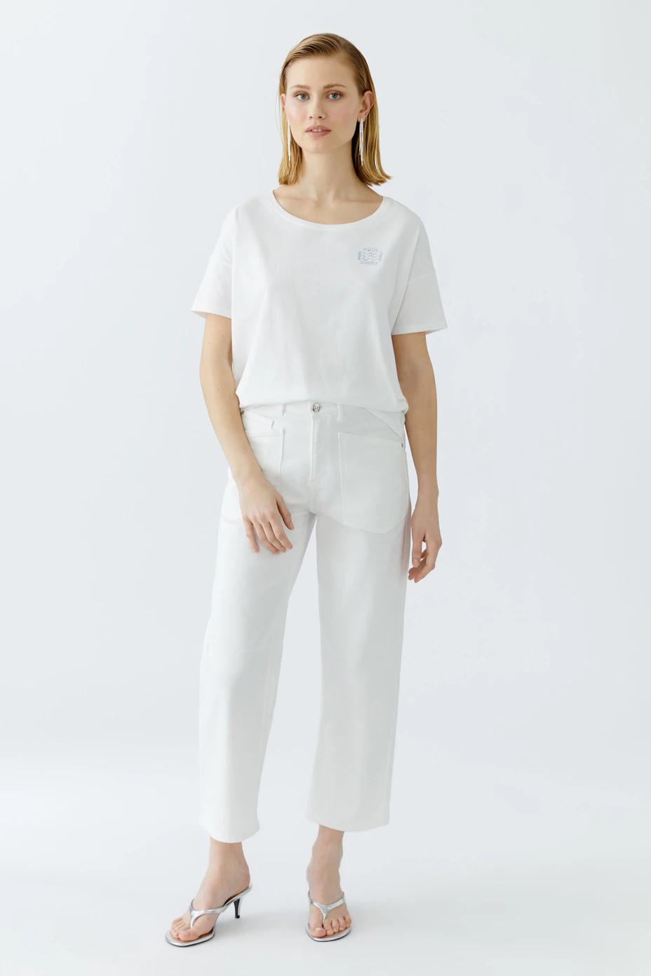 Casual women's T-shirt: A relaxed fit white tee with a small logo detail on the chest.