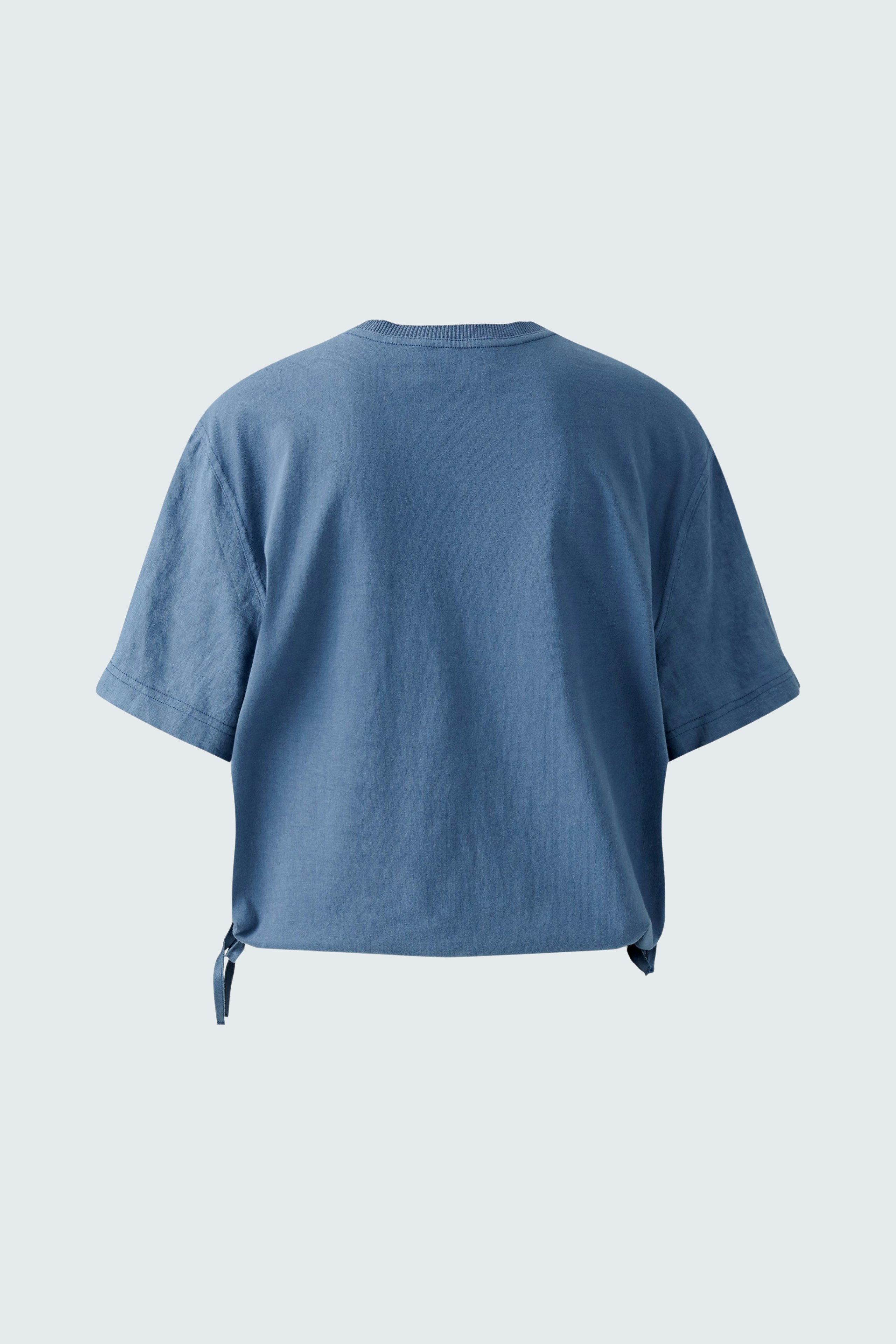 Casual women's blouse shirt in soft blue with a relaxed fit and tie detail at the hem.