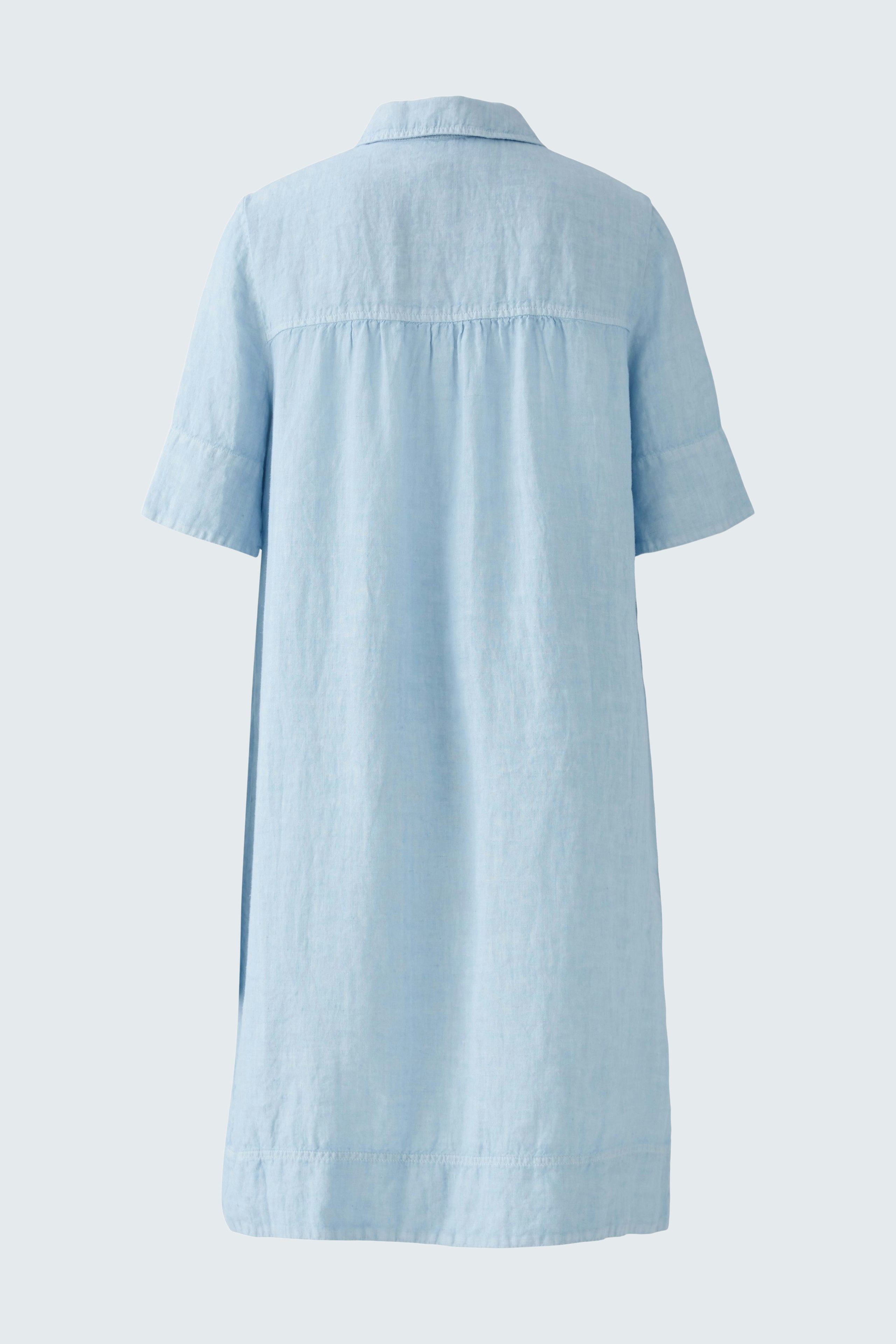 Light blue A-line dress: A woman in a relaxed fit dress with short sleeves and a collar.