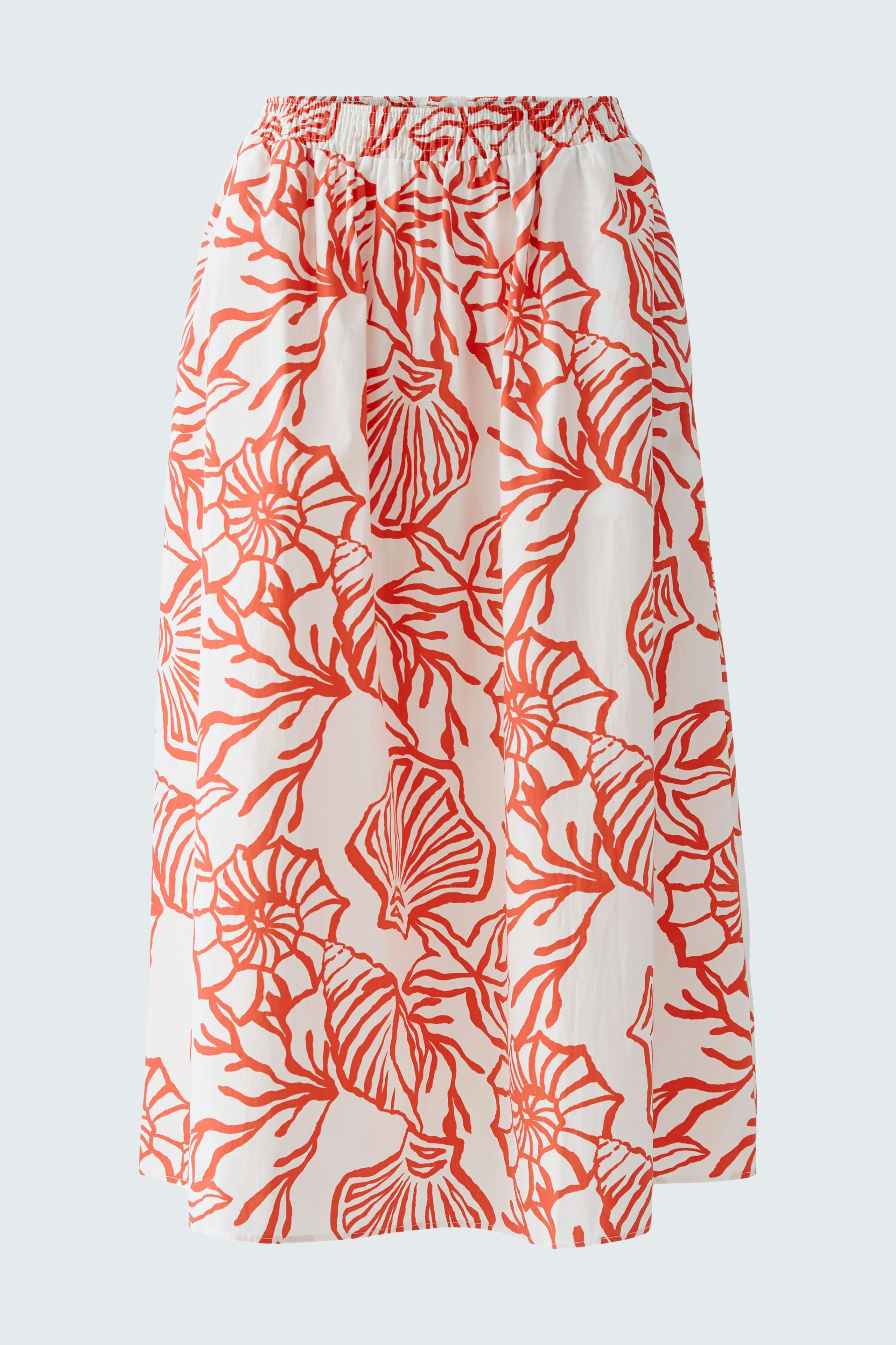 Lightweight maxi skirt with a floral pattern, worn by a woman, perfect for casual summer days.