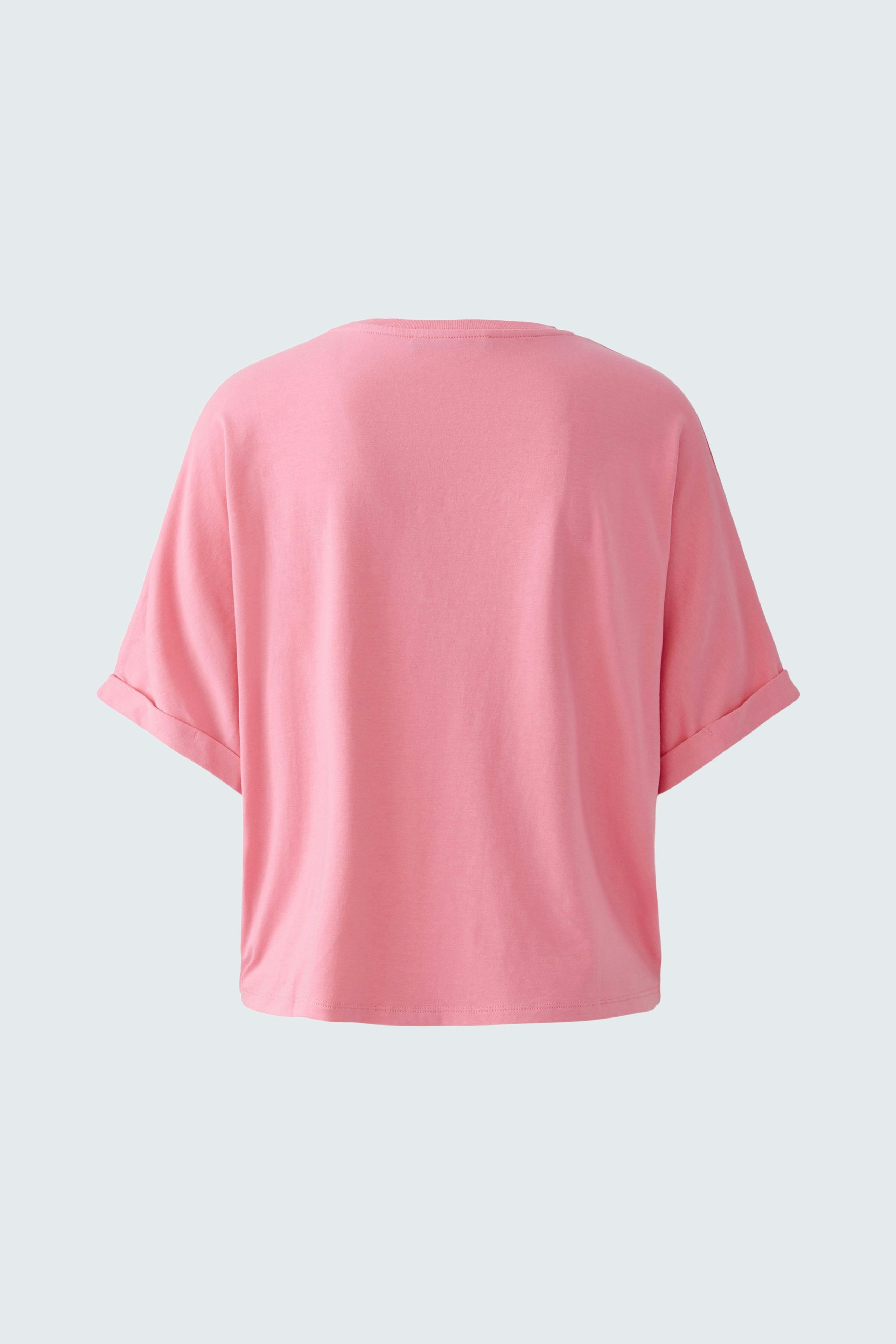 Casual women's pullover: Soft pink top with loose fit and short sleeves, perfect for everyday wear.