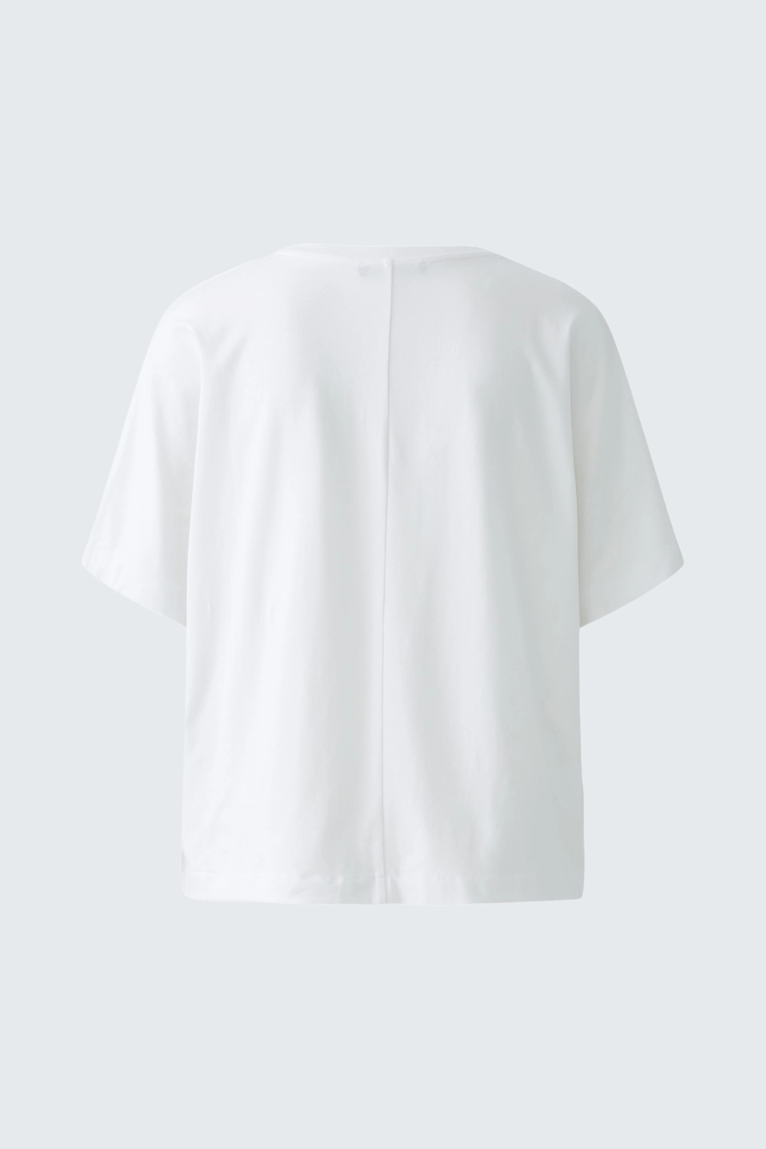 Casual women's top: Back view of a white short-sleeve top with a relaxed fit.